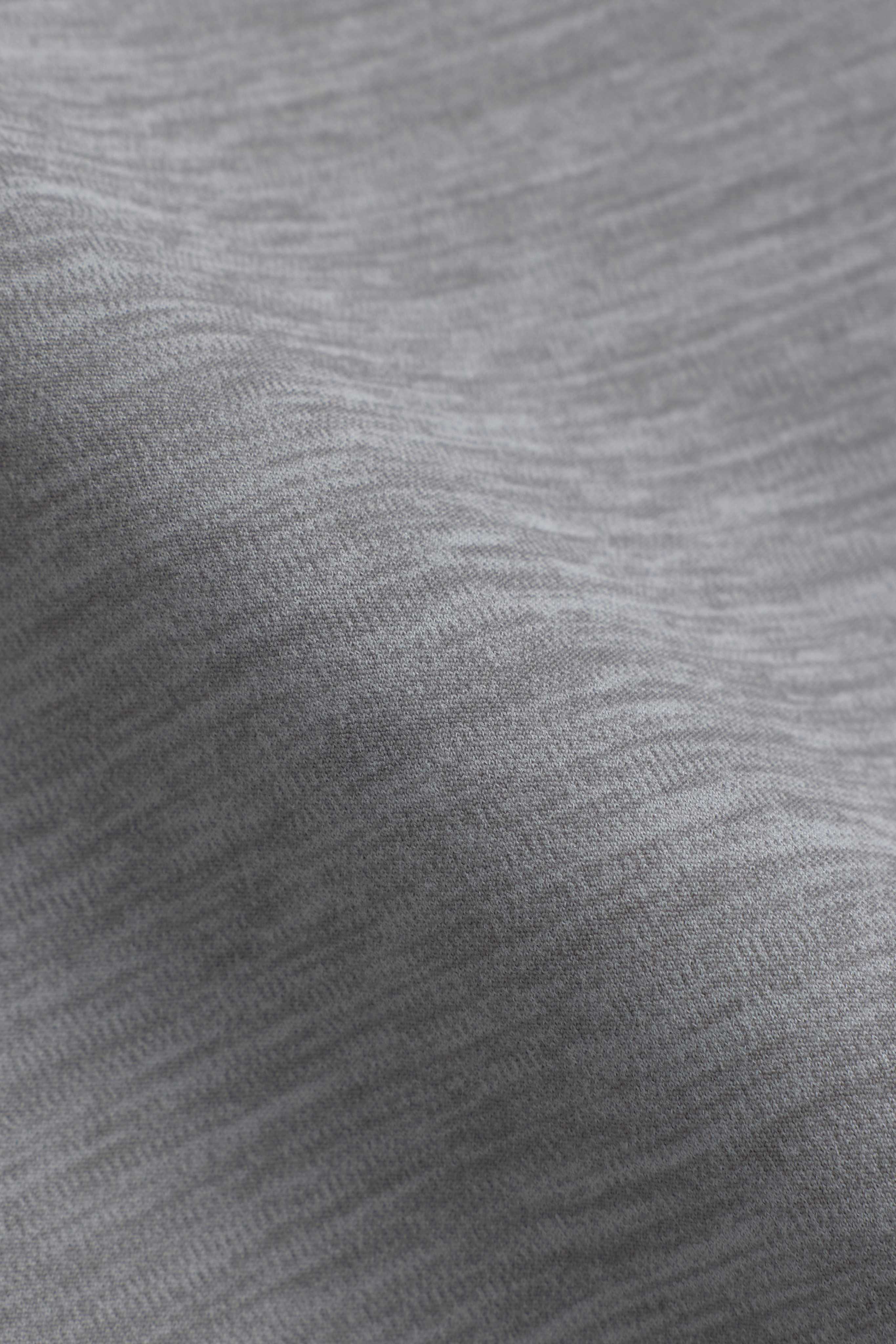 Close-up of the grey melange Cloudform fabric showing its soft, brushed texture.
