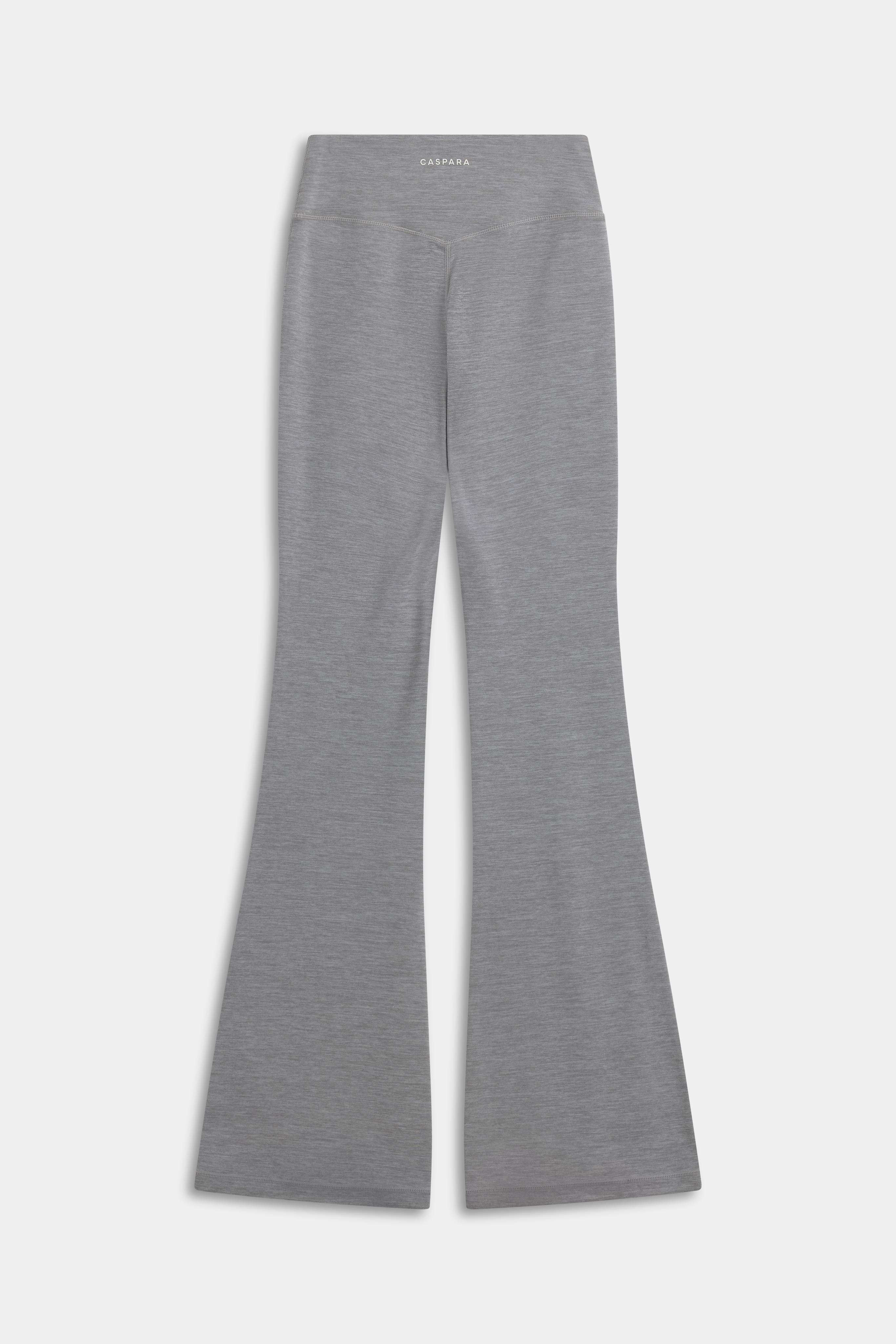 Back view of CASPARA Cloudform yoga pants in grey melange with flared legs.