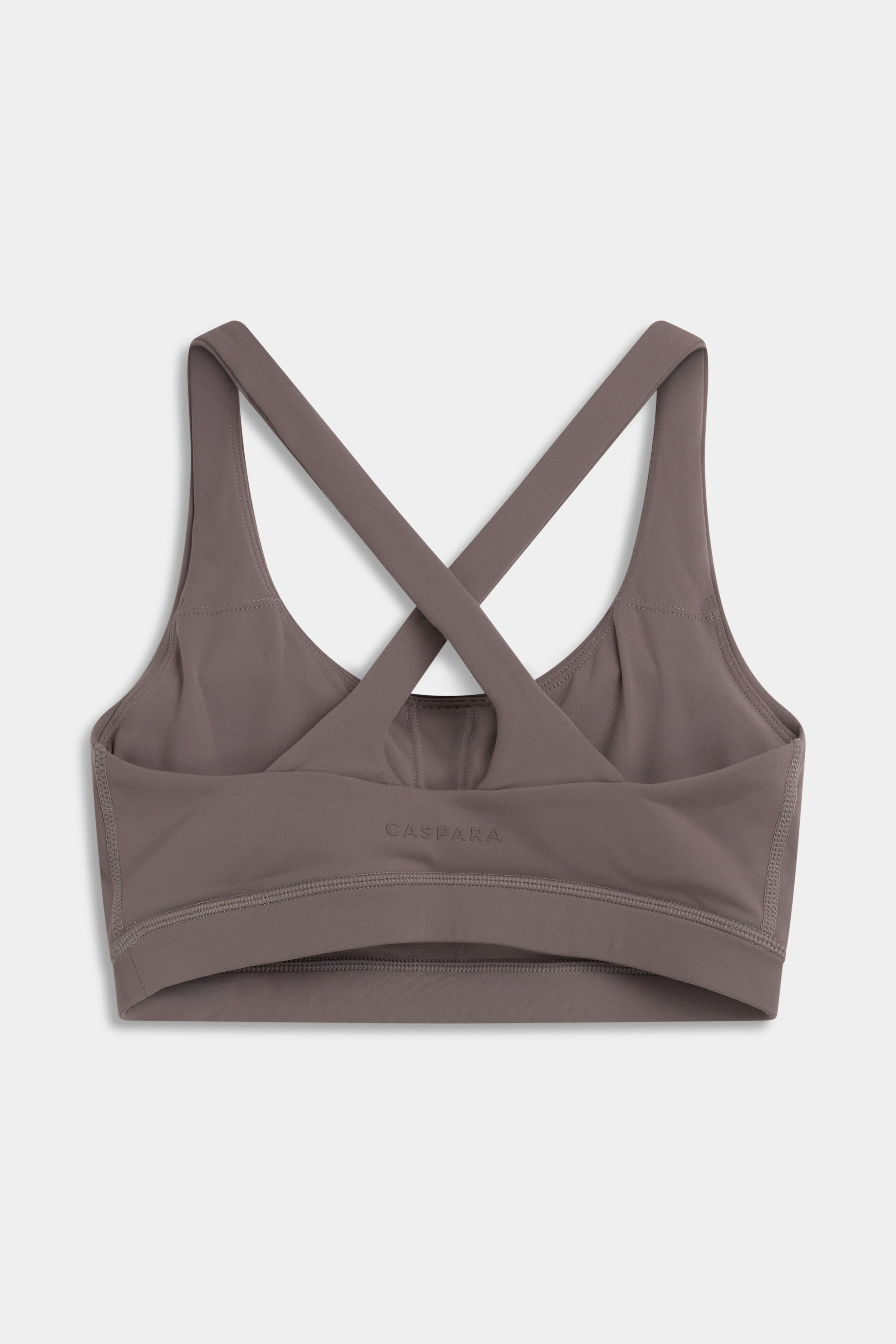 Back view of the walnut CASPARA Cloudform Crossback Sports Bra with crossed straps.