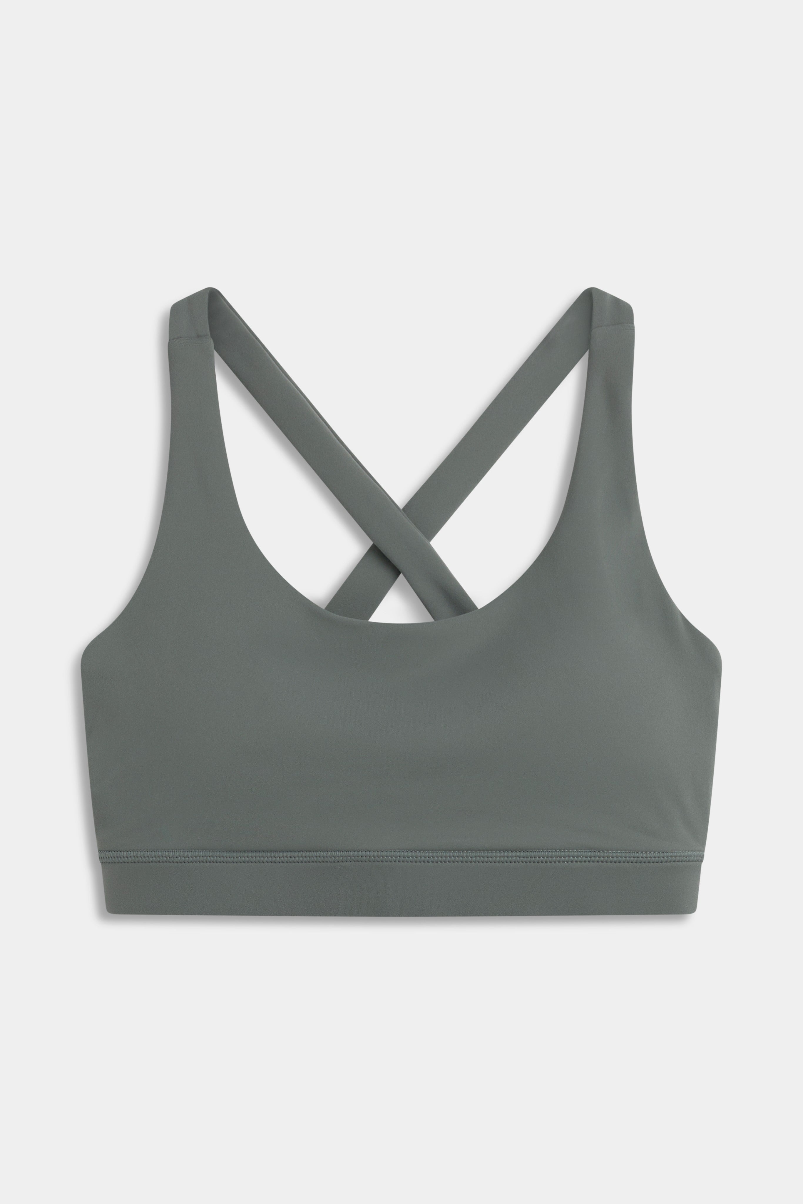 Khaki CASPARA Cloudform® Crossback sports bra shown from the front against a neutral background.