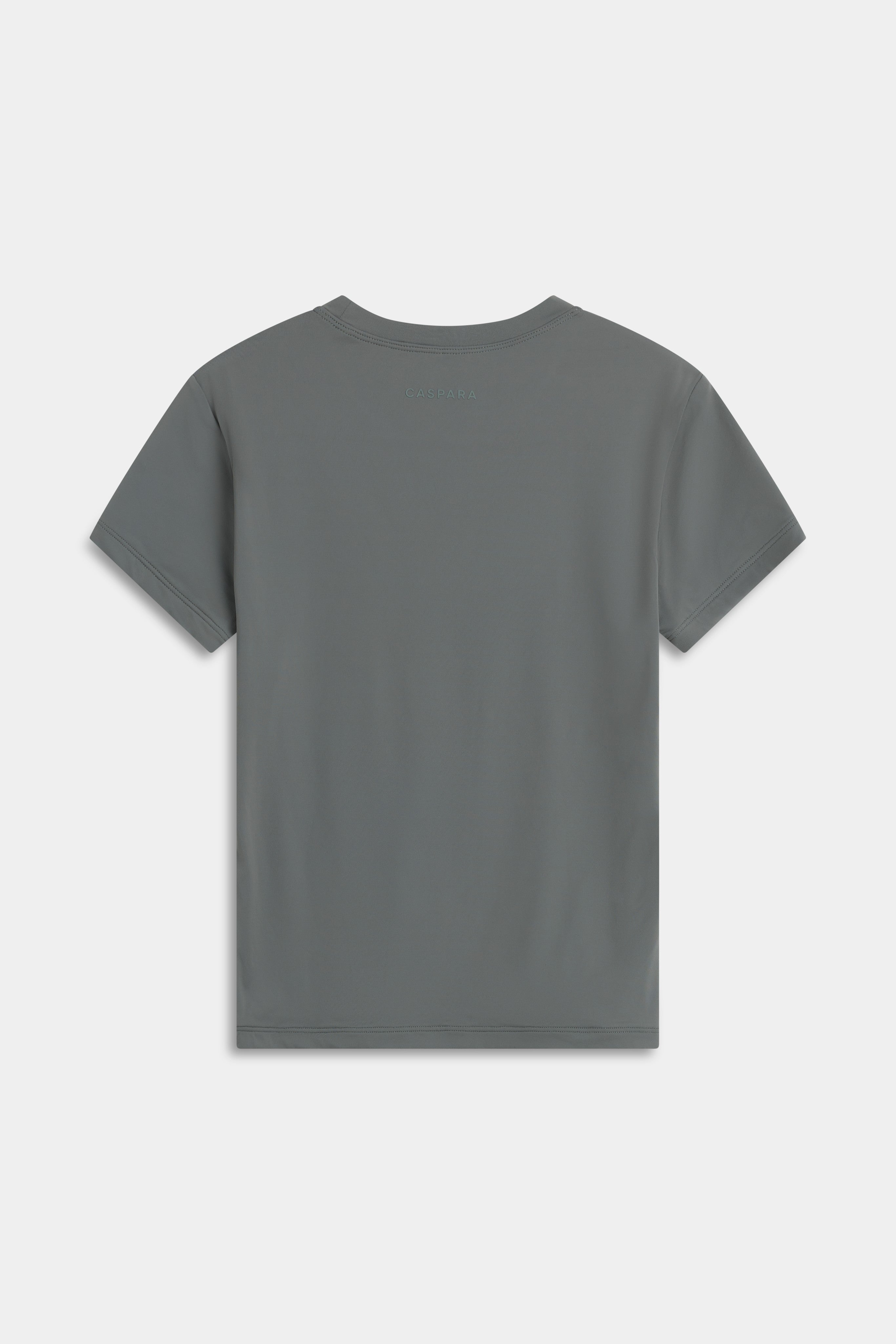 Back view of the khaki CASPARA Cloudform short sleeve top on a light grey background.