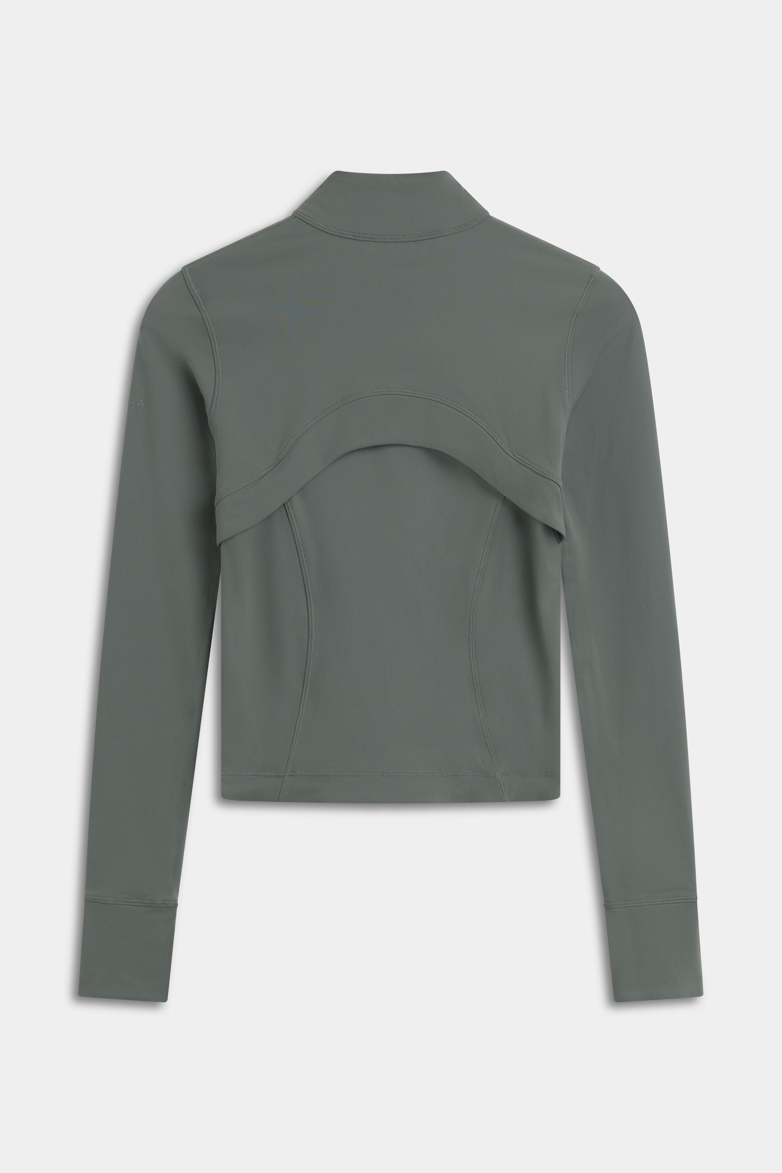 Back view of the khaki CASPARA Sculptluxe Zip Jacket showing the ventilated back panel.