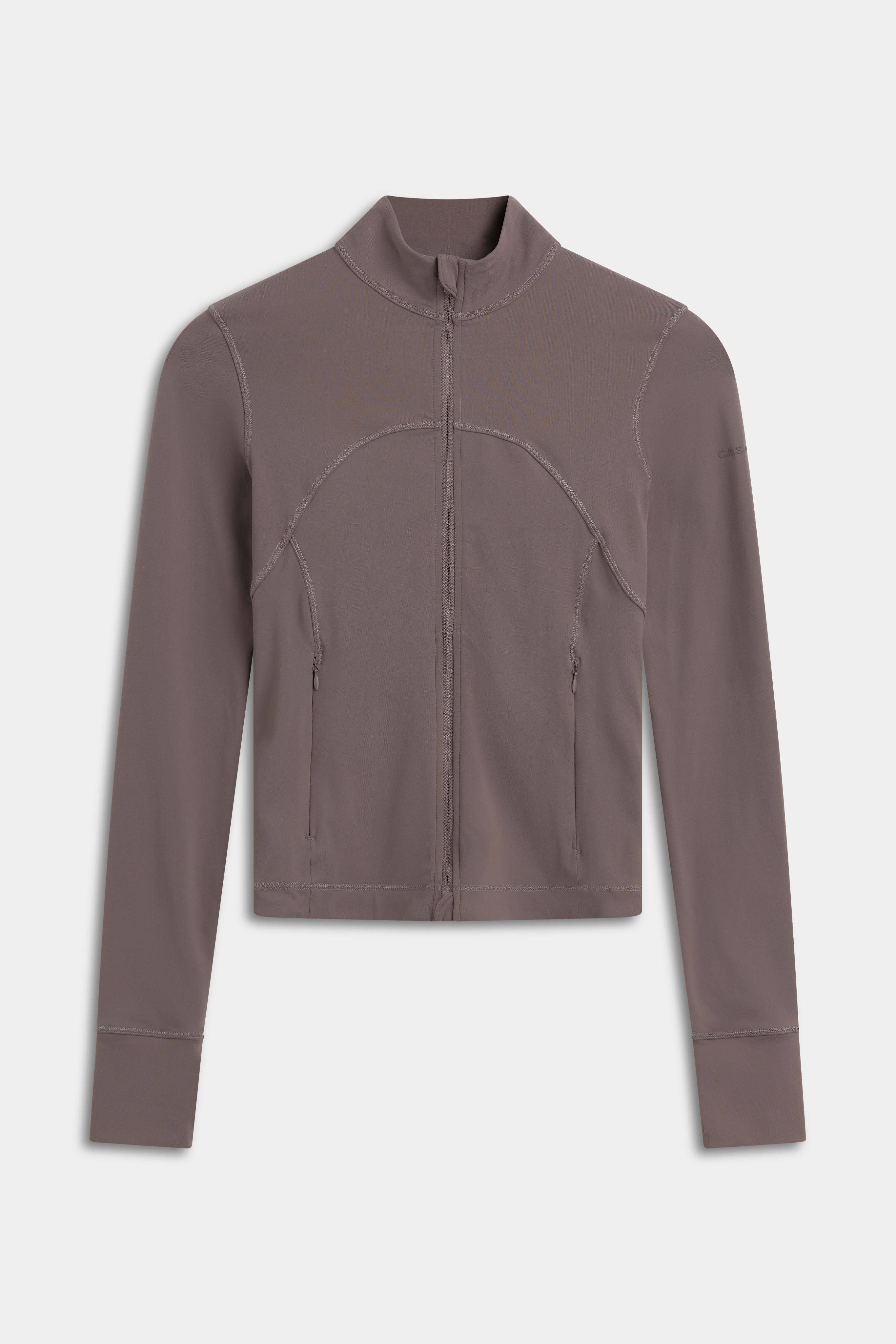 Front view of the walnut CASPARA Sculptluxe Zip Jacket on a light grey background.
