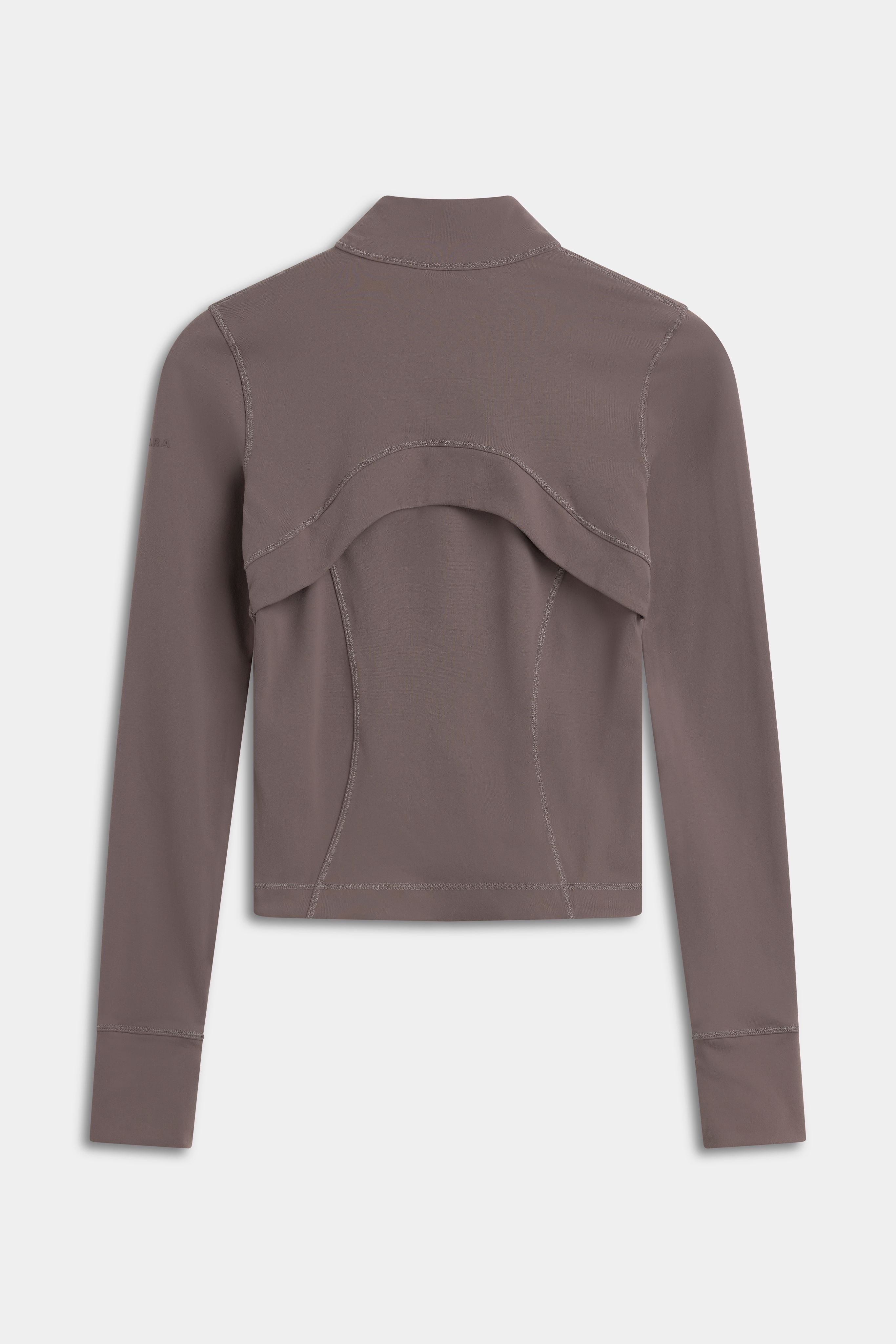 Back view of the walnut CASPARA Sculptluxe Zip Jacket with ventilated back panel.