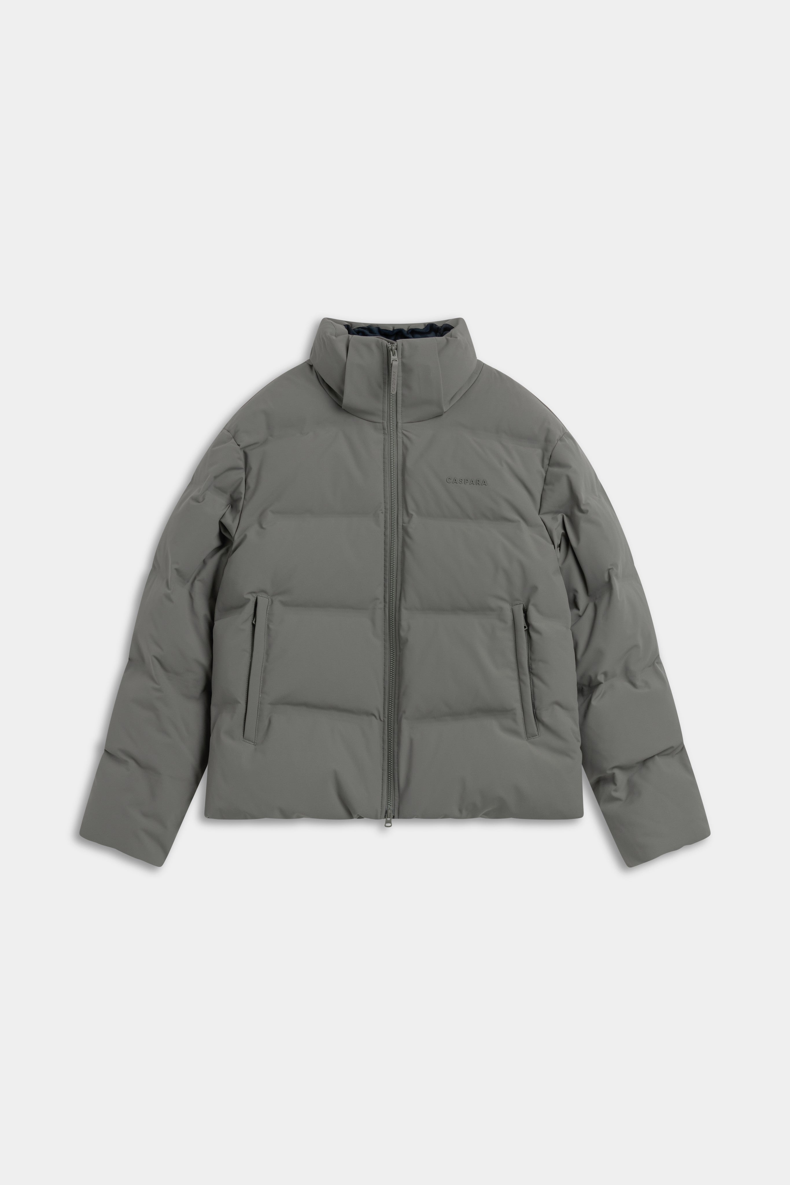 Front view of the khaki CASPARA Aurora puffer jacket with a high collar.
