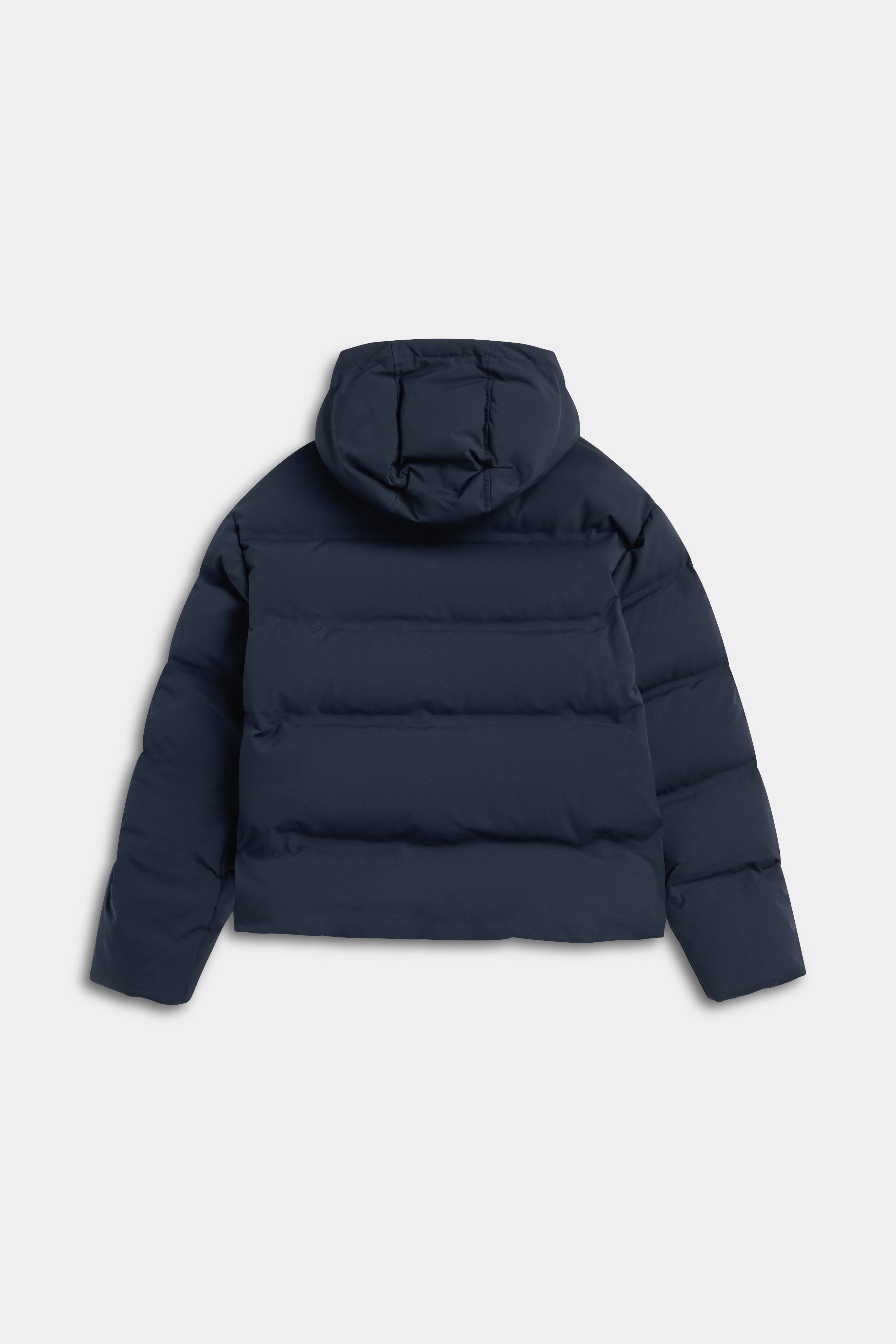 Back view of the CASPARA Aurora Puffer Jacket in navy with hood.