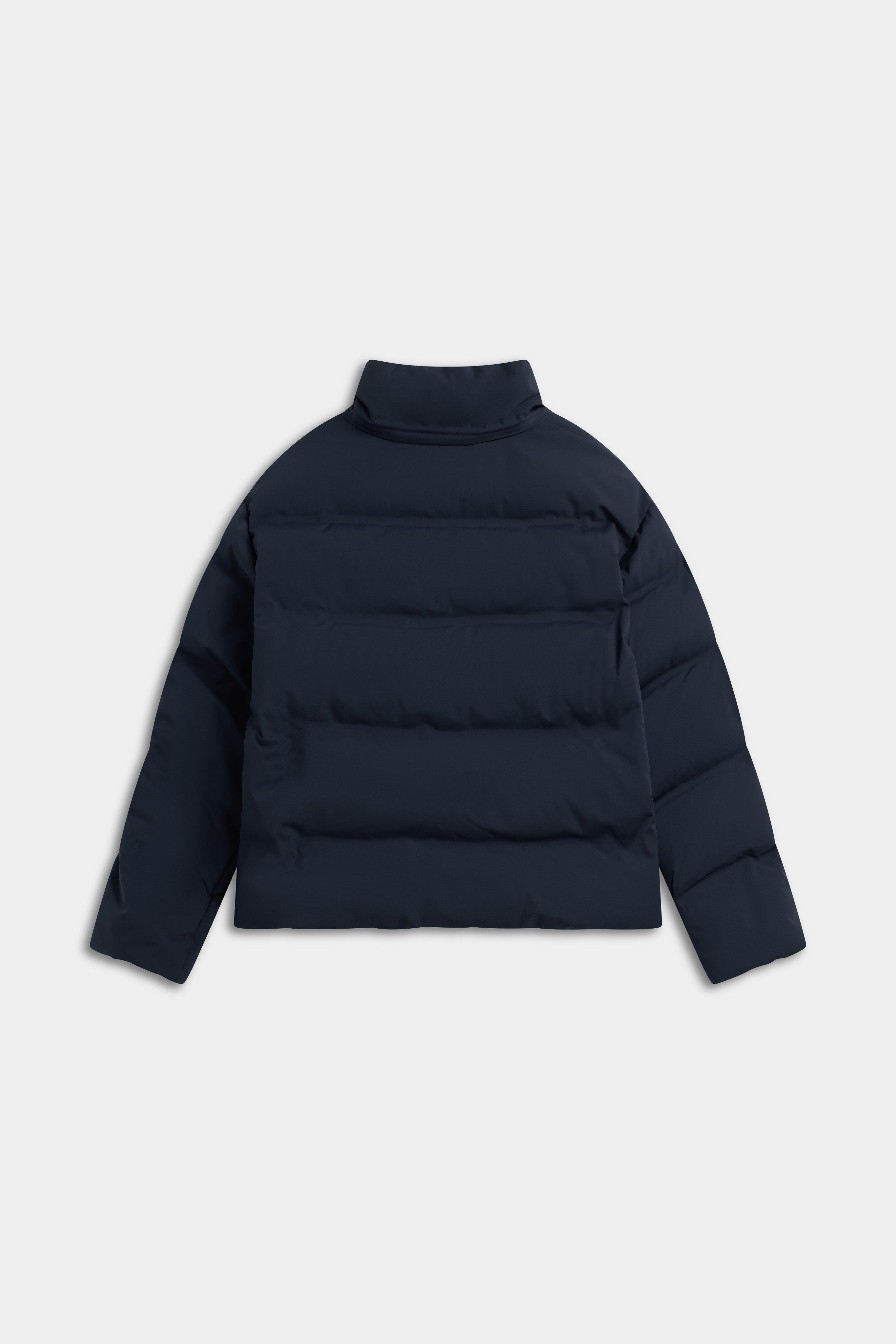 Back view of the navy CASPARA Aurora puffer jacket featuring horizontal quilting and a stand collar.