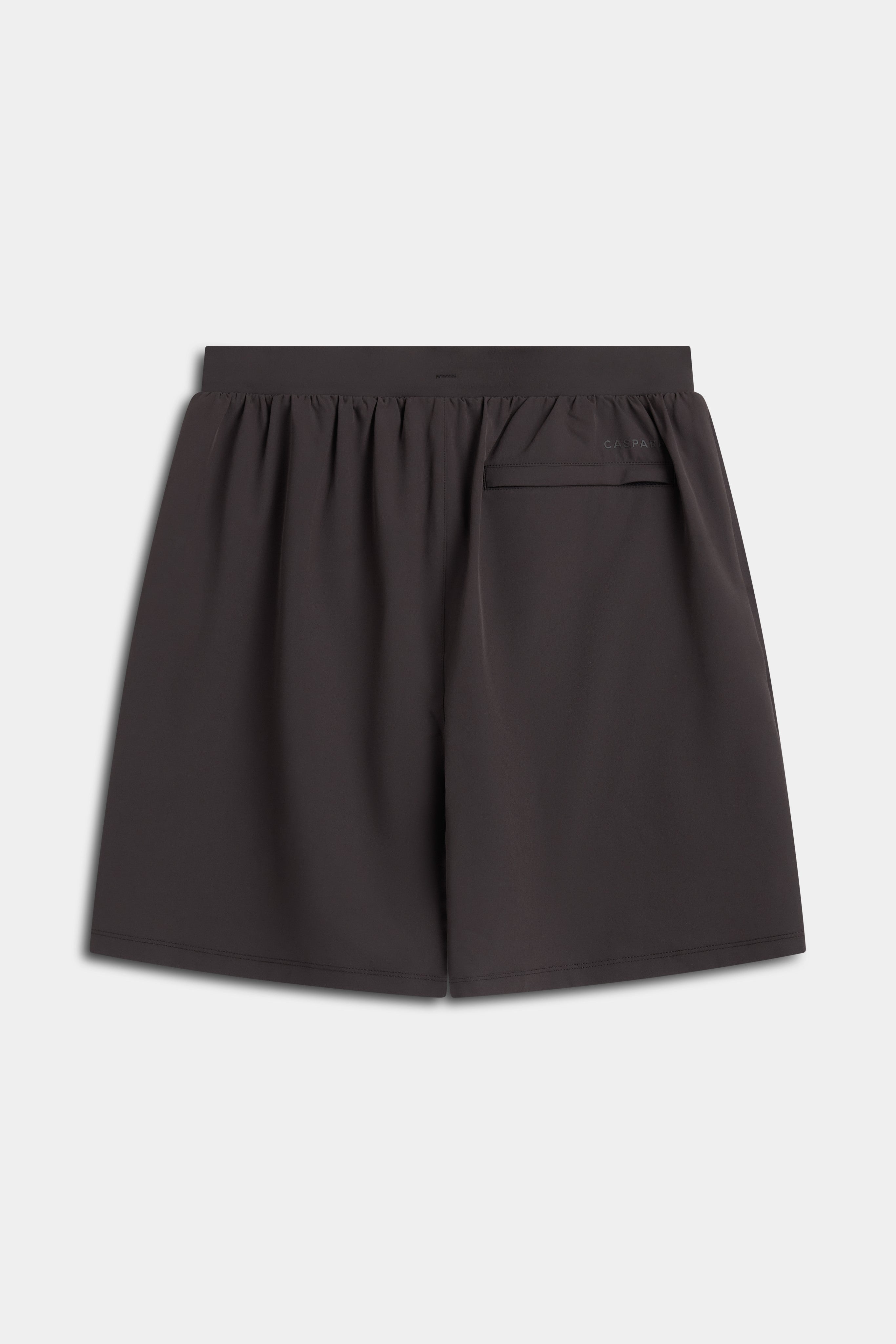 Back view of the espresso CASPARA Vantage 2-in-1 training shorts.