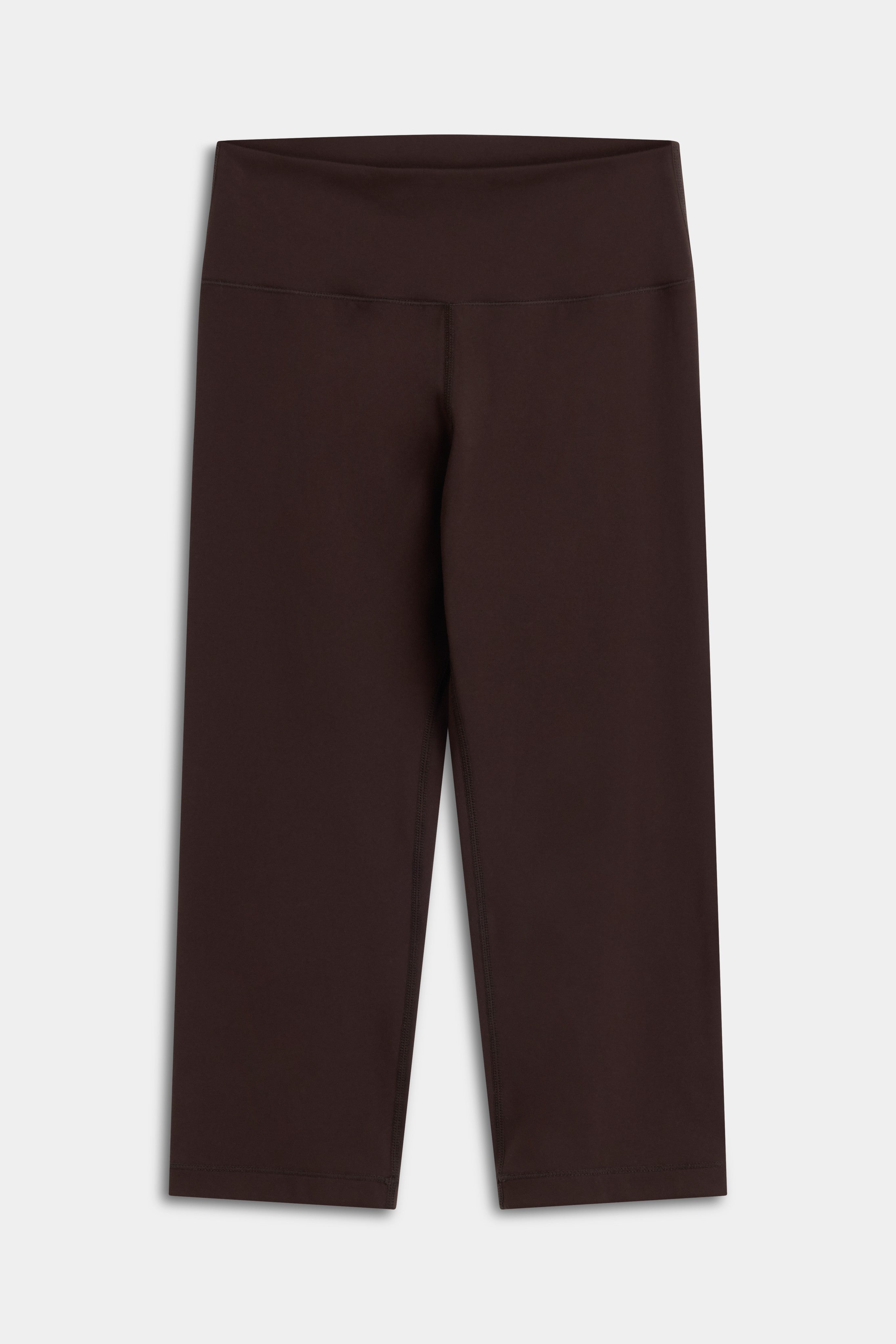 Front view of the CASPARA Cloudform Capri leggings in espresso brown.