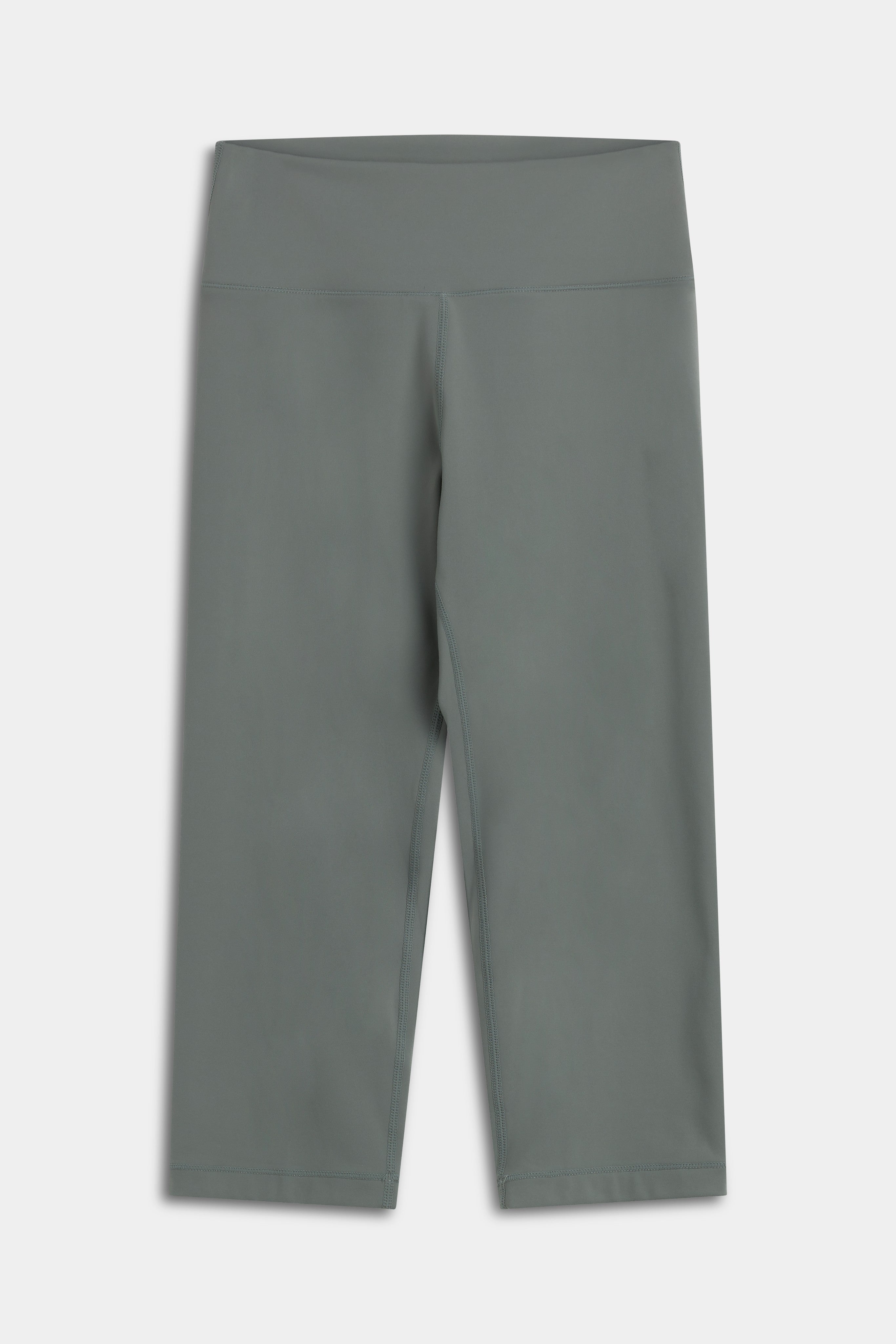 Front view of khaki CASPARA Cloudform Capri leggings against a light background.