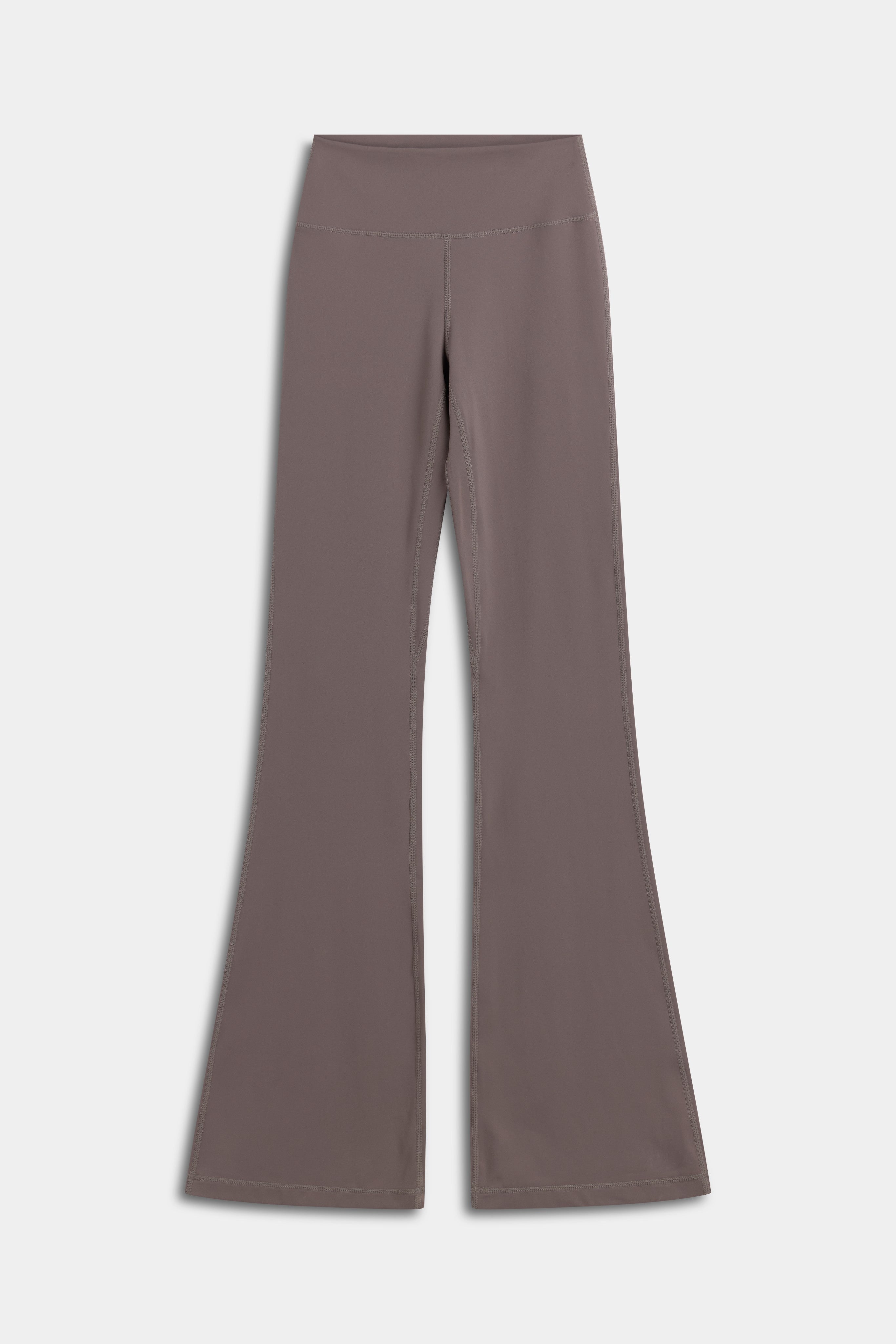 Front view of CASPARA Cloudform flared yoga pants in walnut.