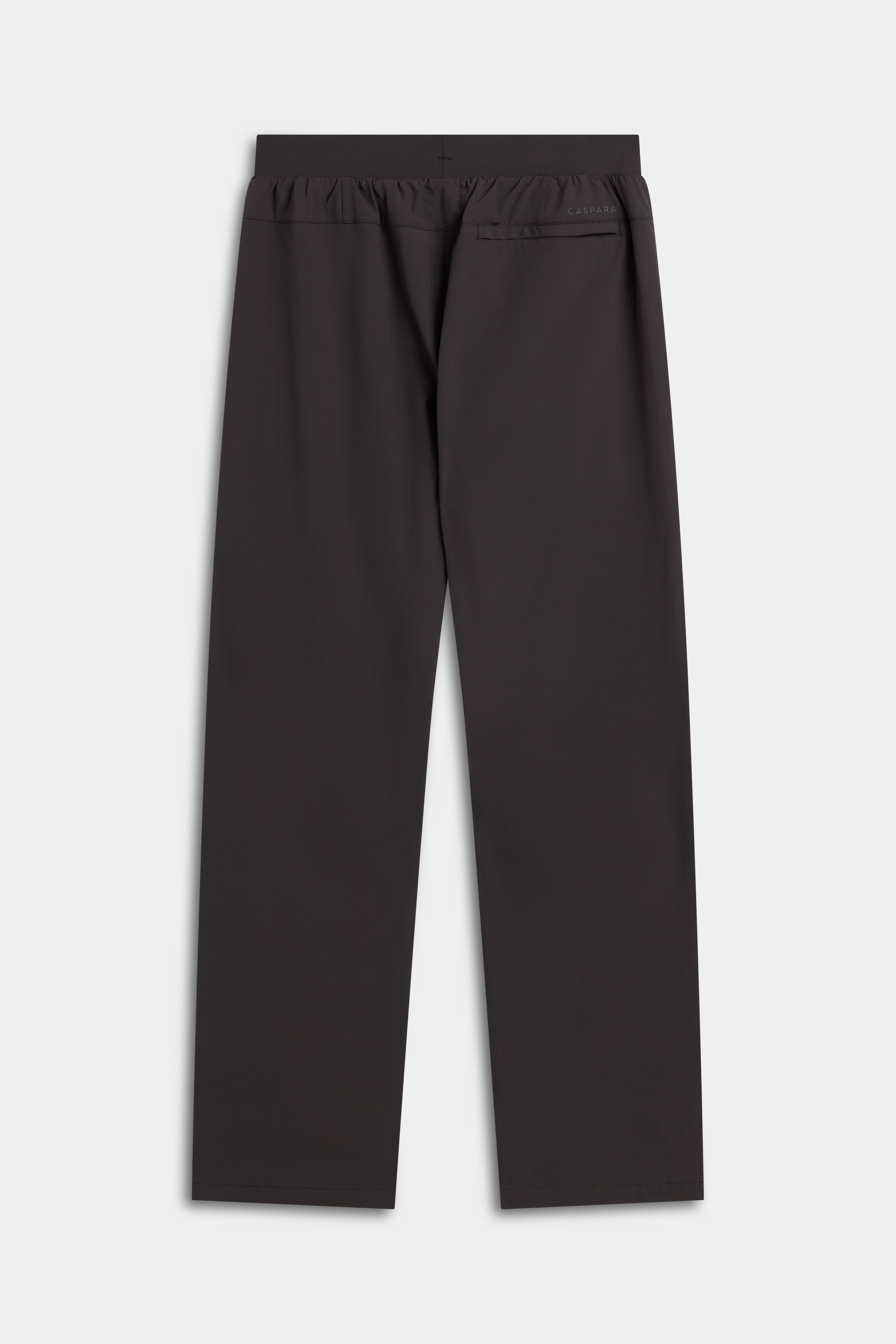 Back view of CASPARA M. Prime Core Pants in espresso laid flat against a neutral background.