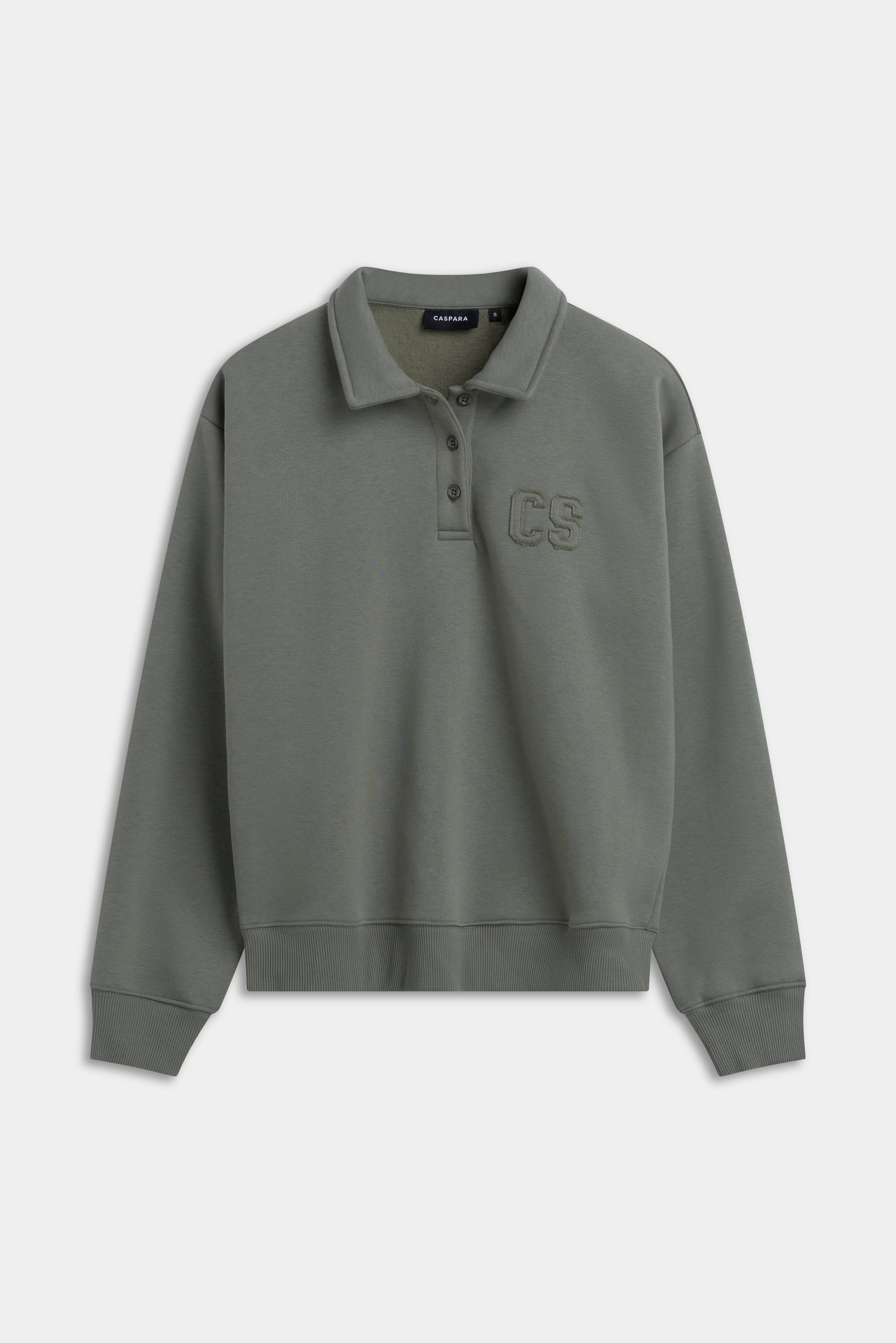 Khaki CASPARA CS rugby shirt with a classic collar and embroidered chest logo.