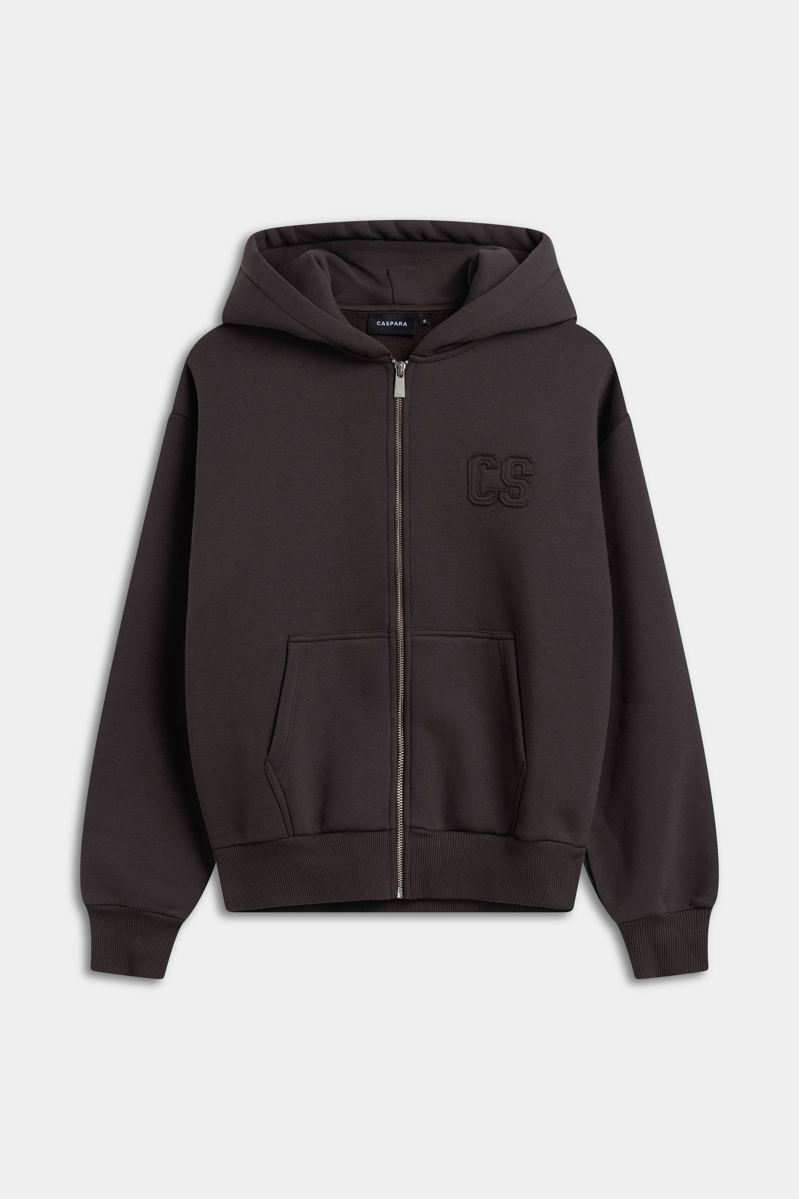 CASPARA CS zip hoodie in espresso brown with a silver front zipper and chest logo.