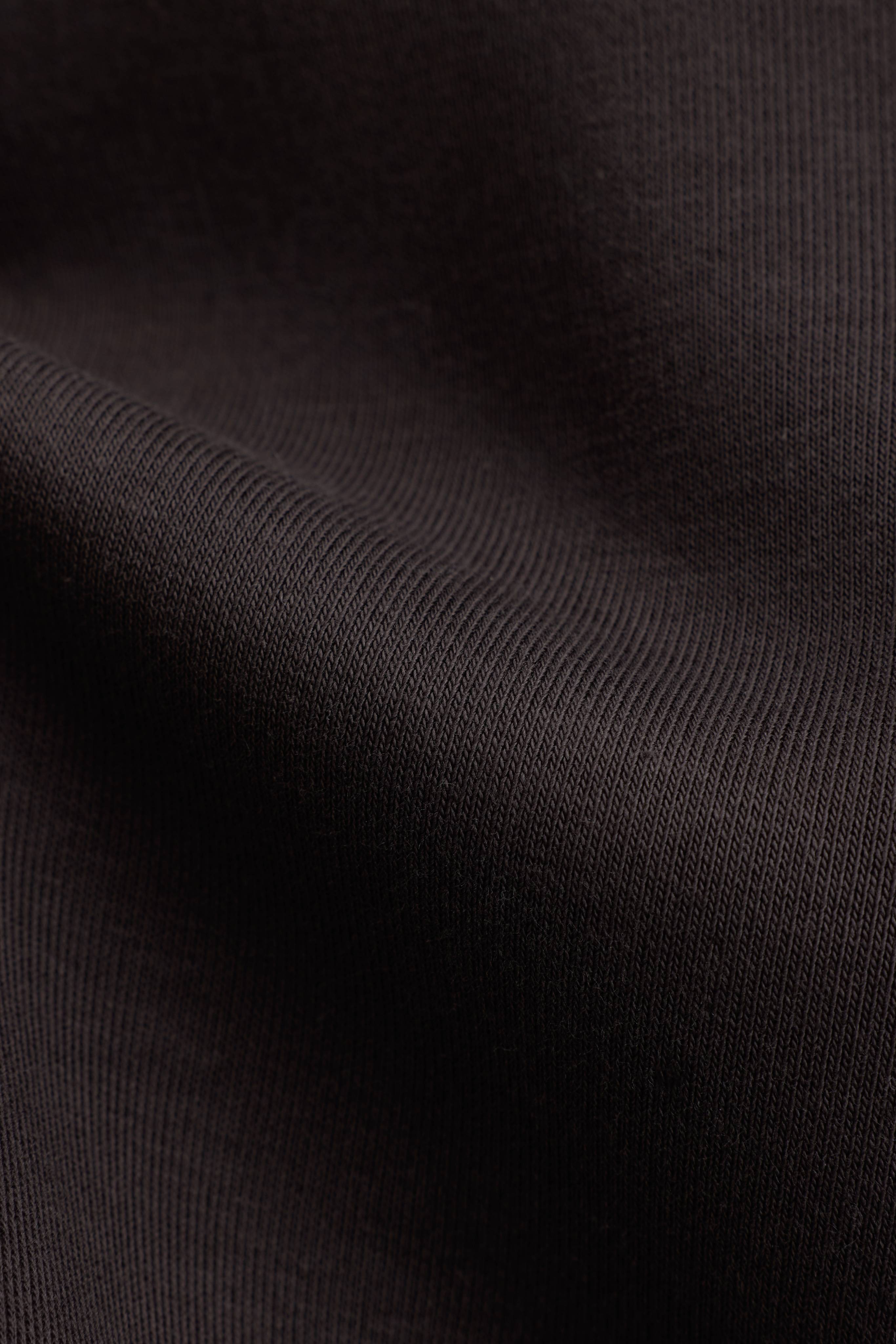 Close-up of the espresso brown fabric texture on the CASPARA CS Zip Hoodie.