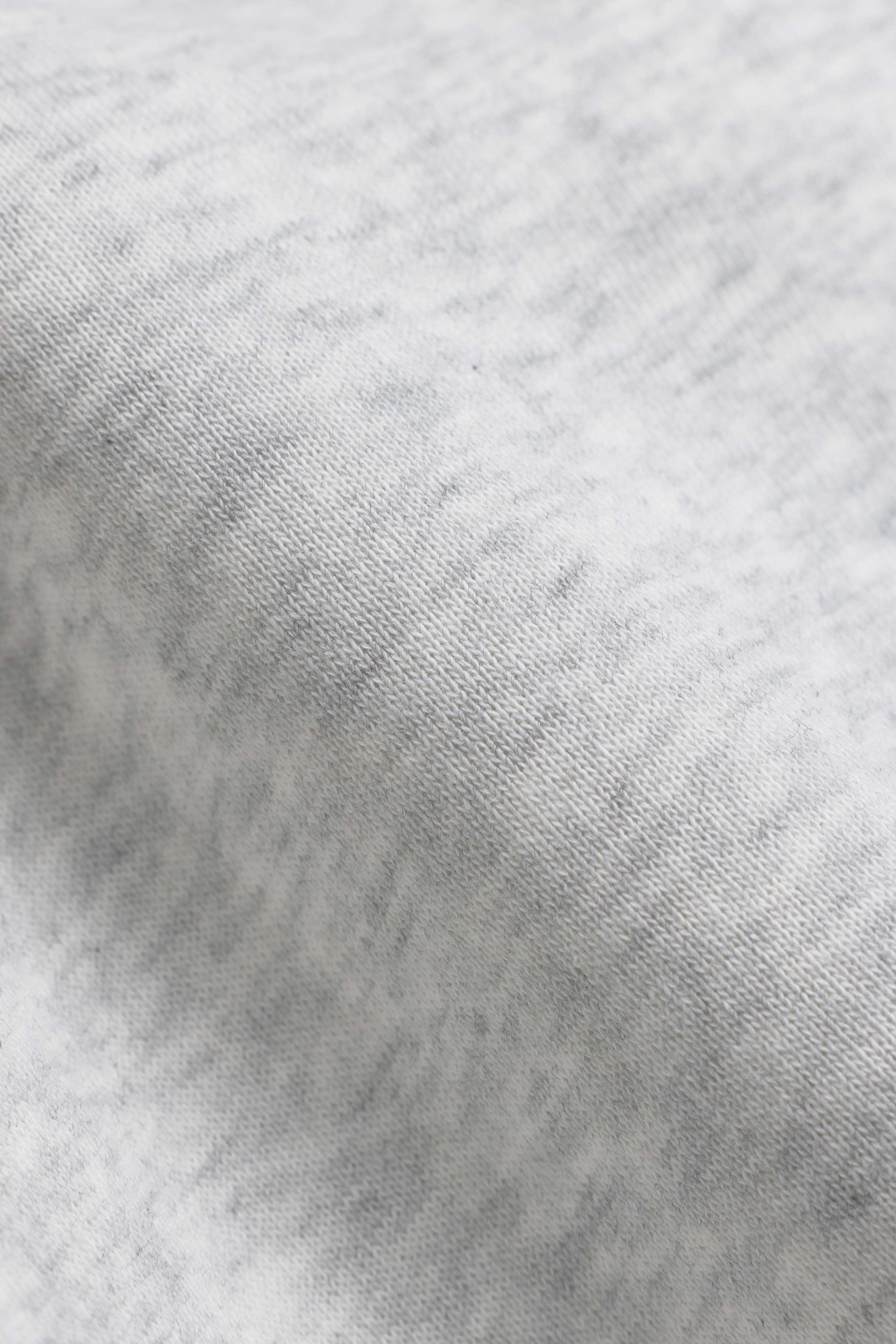Close-up of the soft grey melange knit fabric on a CASPARA CS zip hoodie.