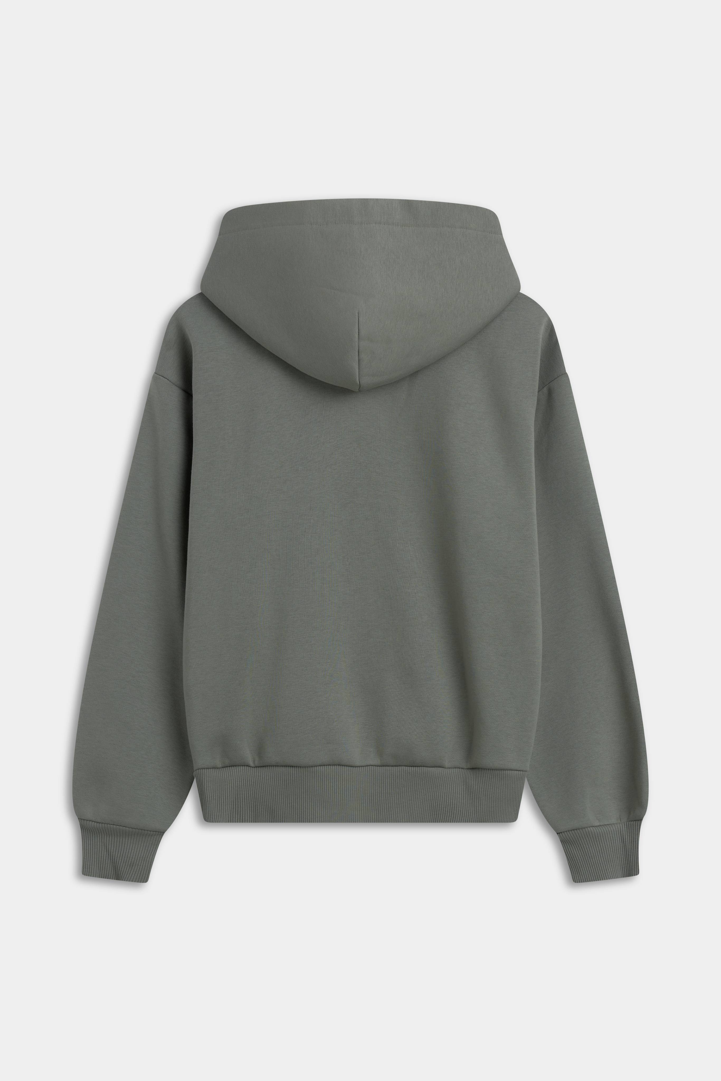 Back view of the khaki CASPARA CS Zip Hoodie against a light grey background.