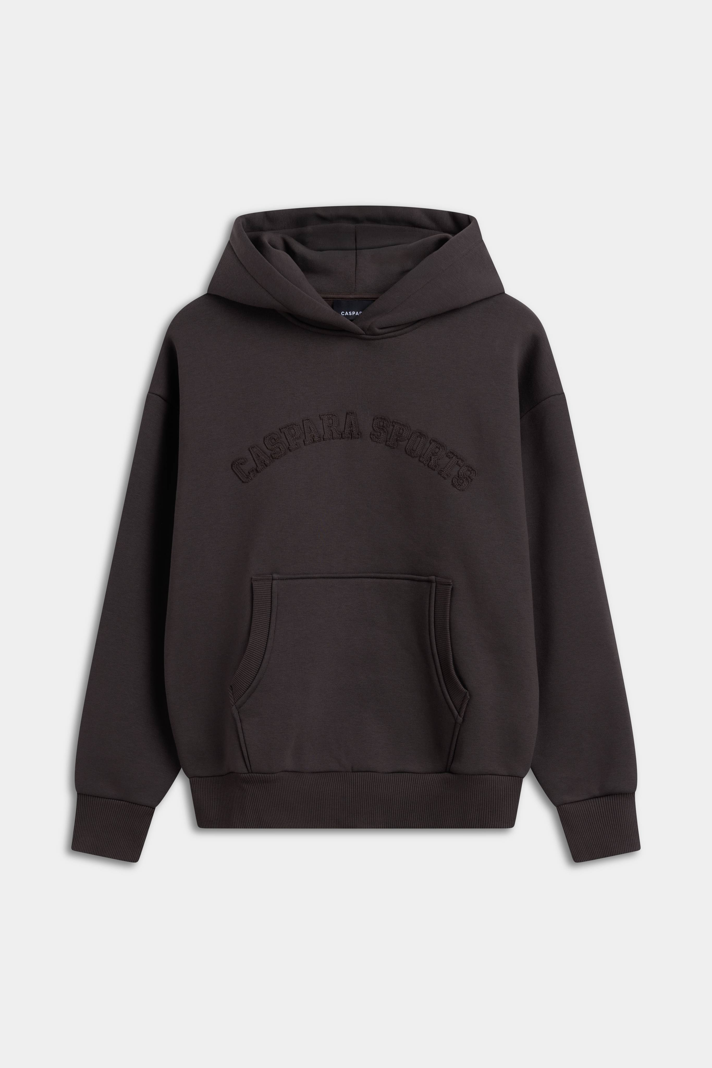 Women's CASPARA CS Hoodie in espresso with tonal chest embroidery and a front pouch pocket.