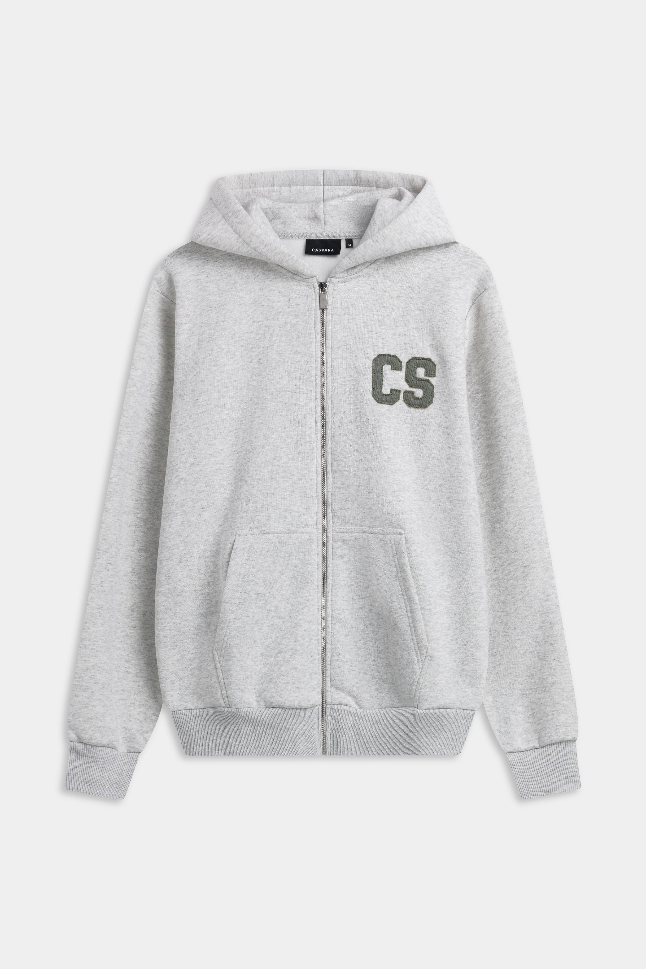 Grey melange CASPARA CS zip hoodie with a khaki CS logo patch on the chest.
