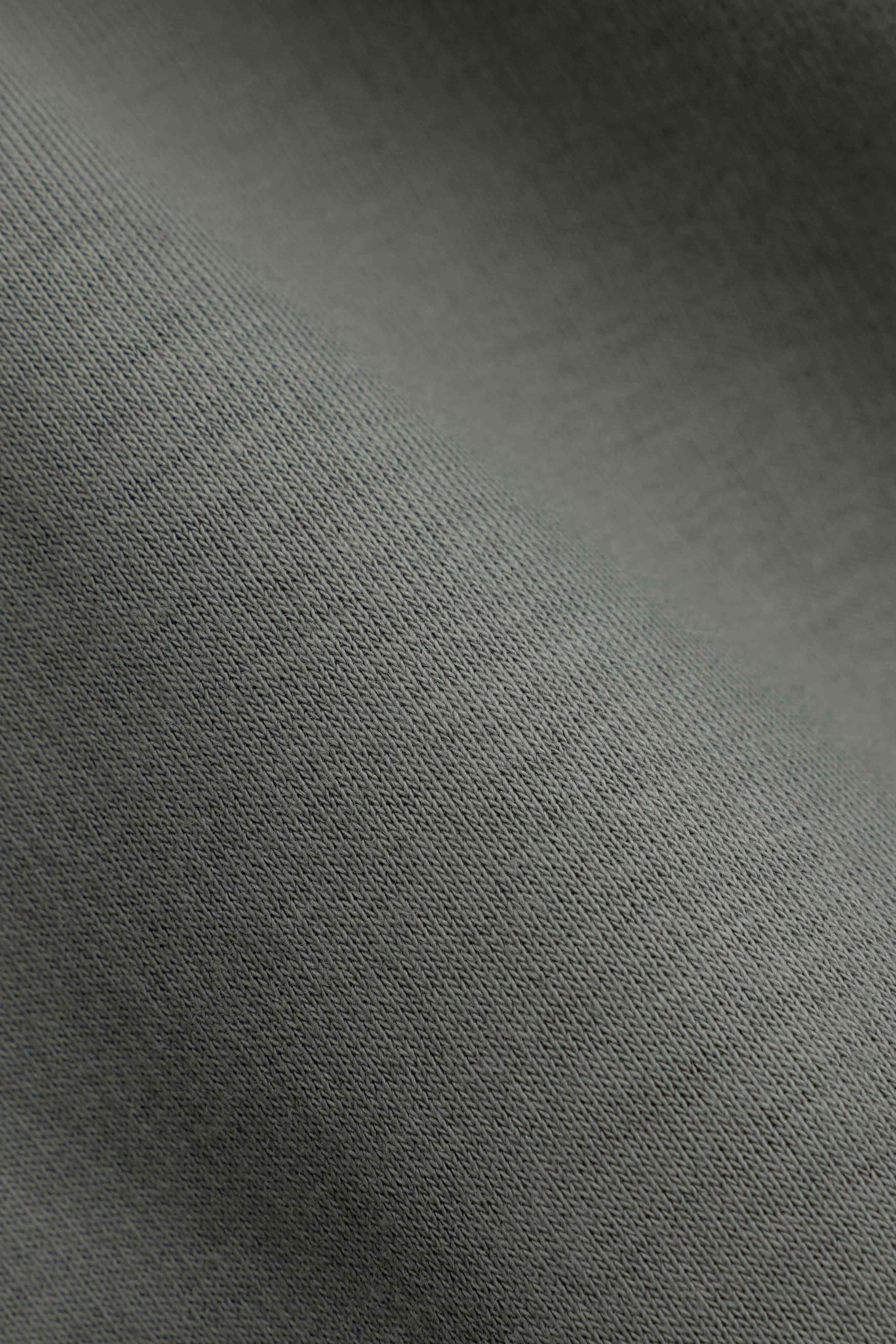 Close-up of the khaki knit fabric on a CASPARA CS zip hoodie.