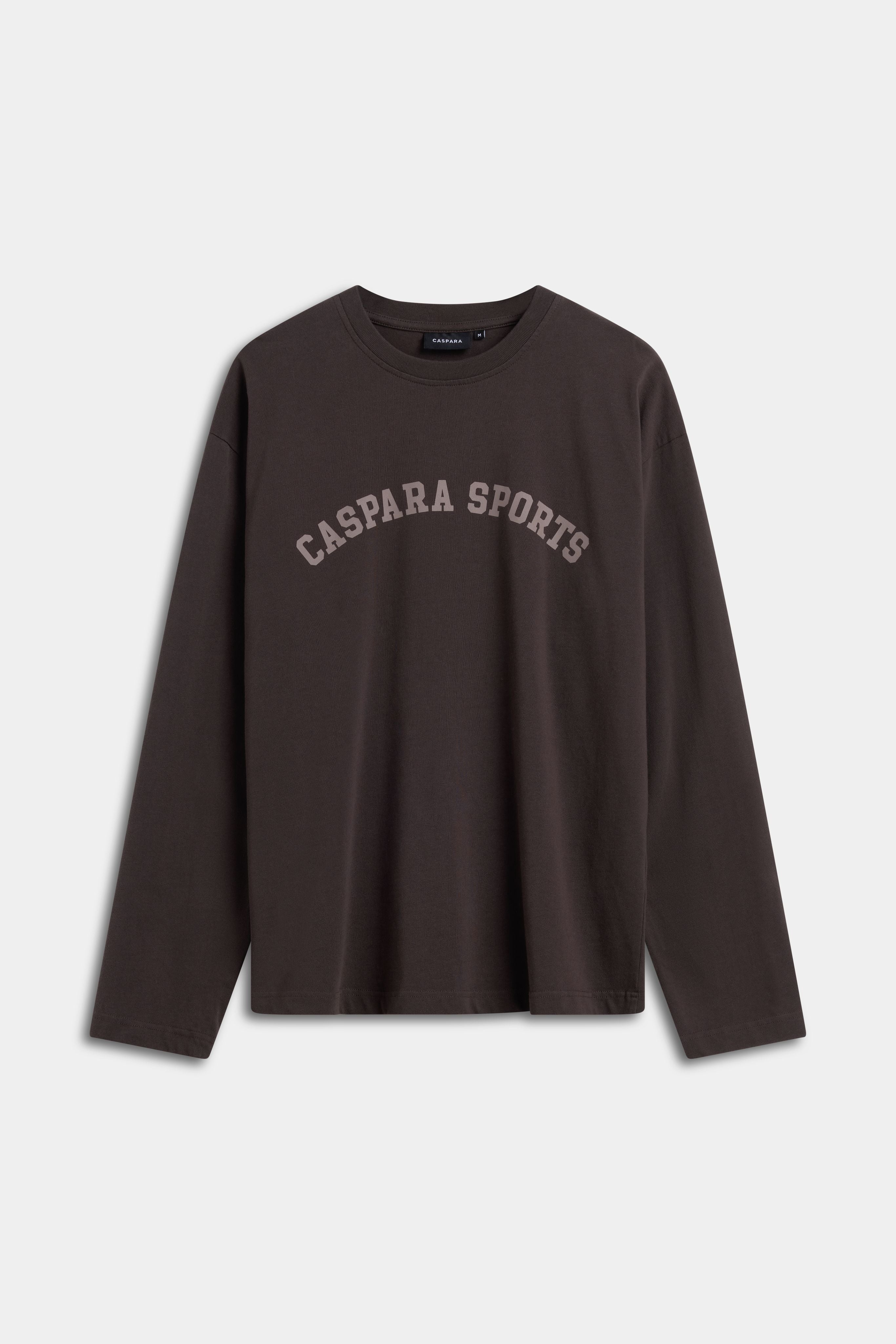 Espresso CASPARA CS Signature long sleeve t-shirt with CASPARA SPORTS printed on the chest.