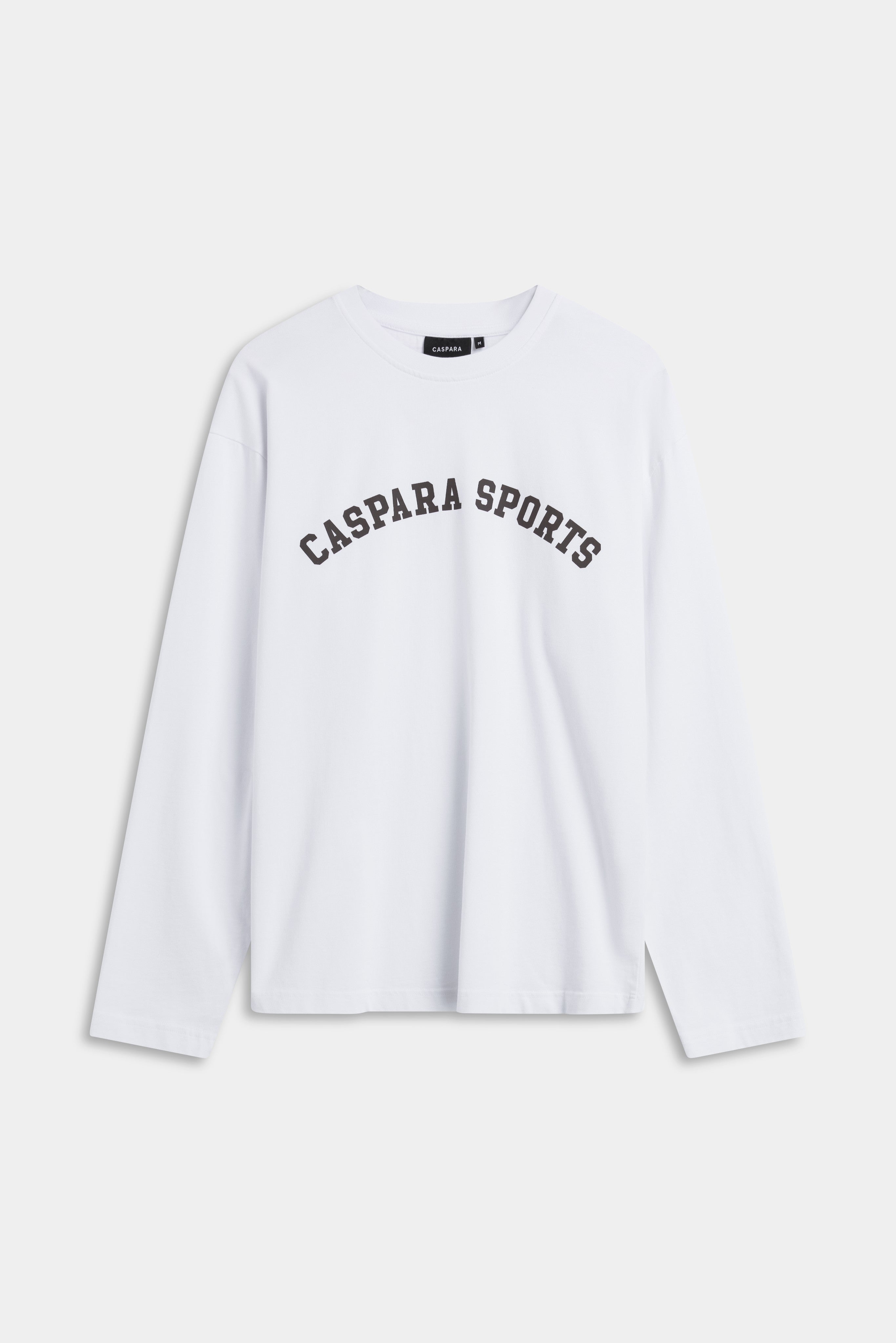 White CASPARA long sleeve t-shirt with arched espresso CASPARA SPORTS lettering across the chest.