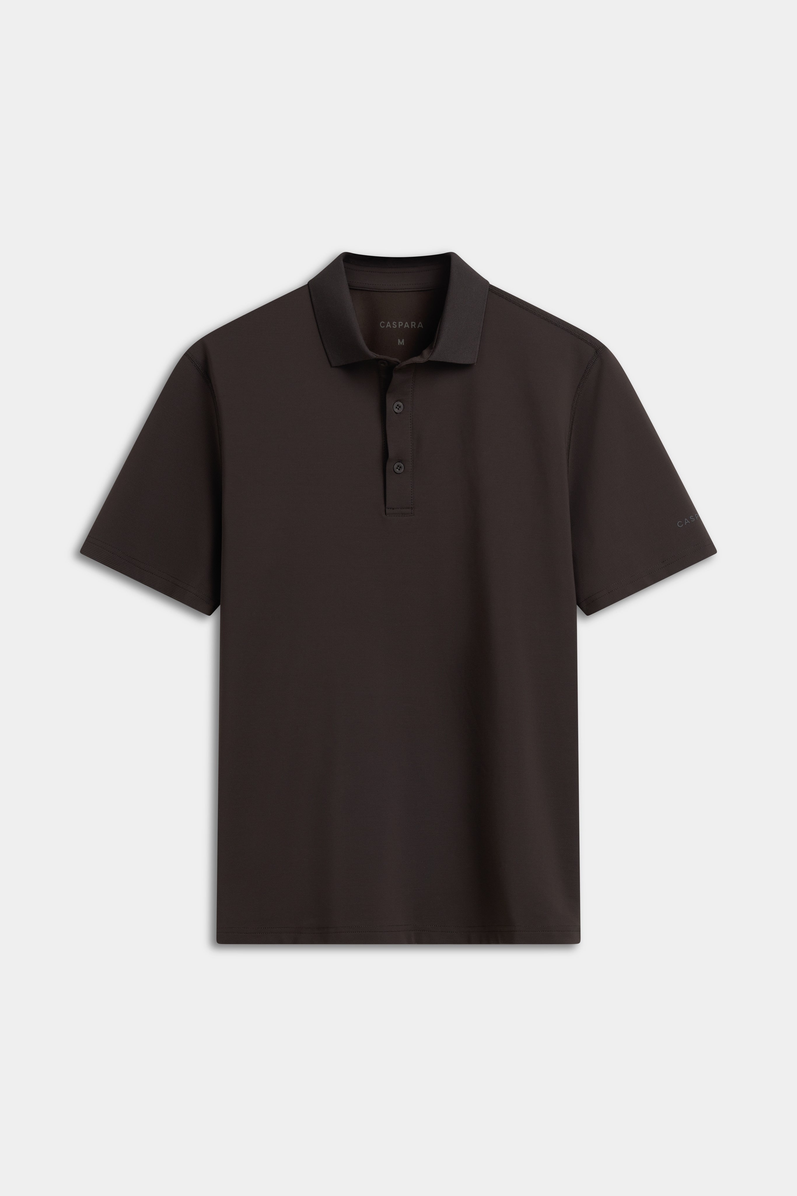 CASPARA M. Vantage Polo Tee in espresso brown, shown from the front against a neutral background.