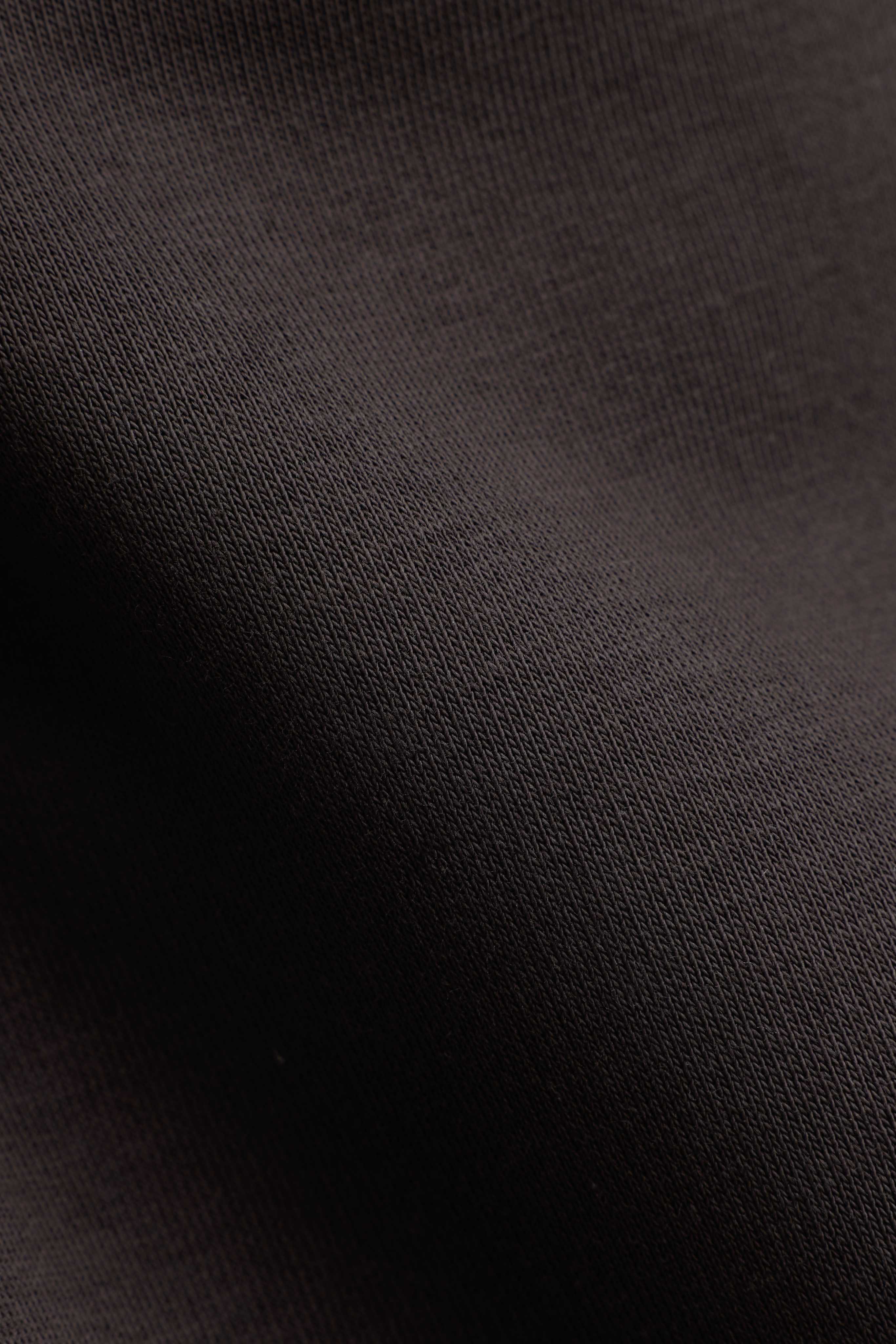 Close-up of espresso brown fabric showing the detailed knit weave and texture.