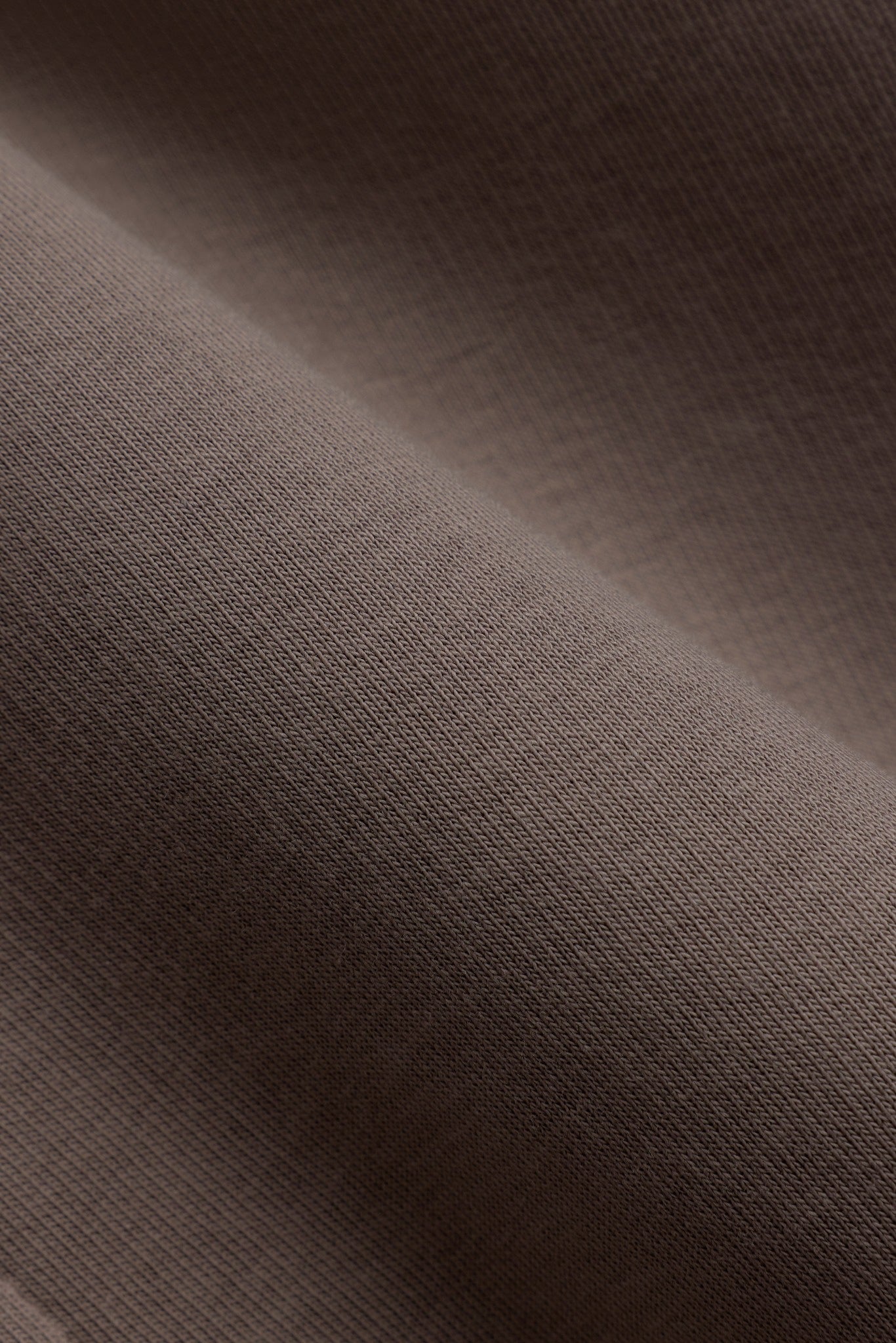 Close-up of the smooth walnut brown cotton-blend fabric on the CASPARA All-Star zip hoodie.