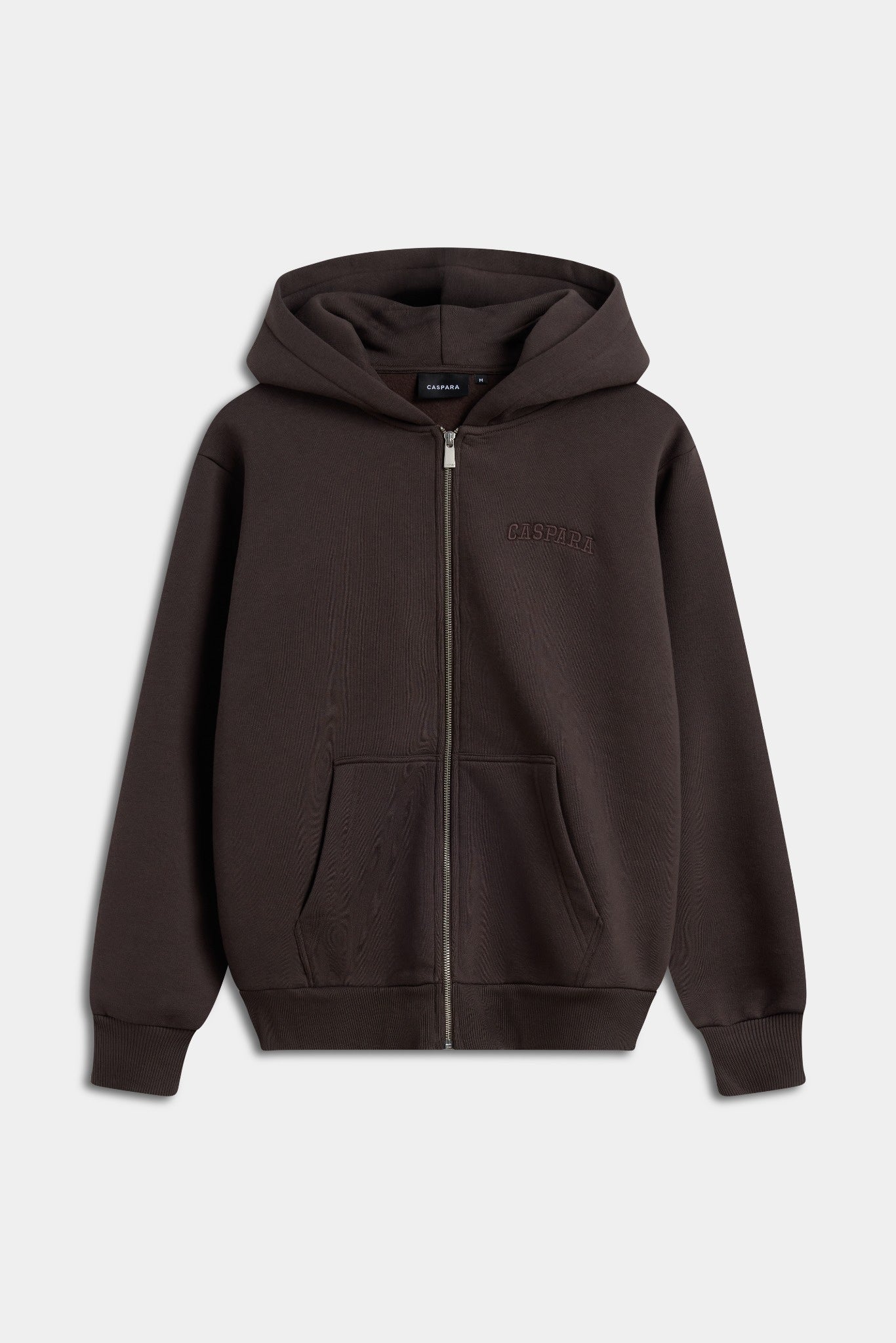 Espresso brown CASPARA zip-up hoodie with embroidered chest logo against a light grey background.