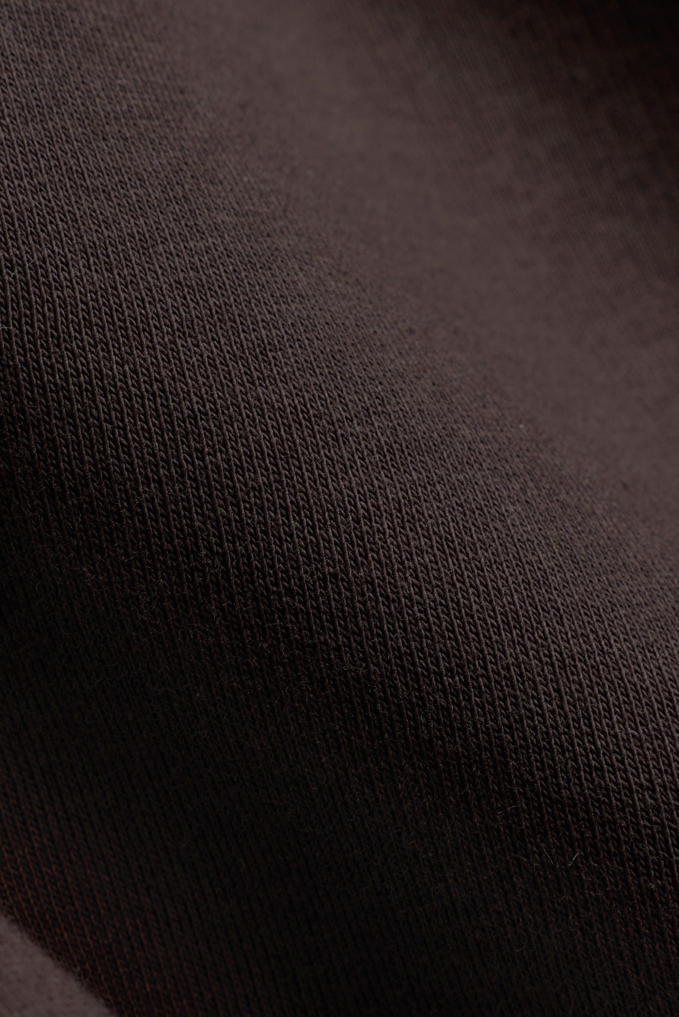 Close-up of the espresso brown cotton-blend fabric on the CASPARA All-Star crewneck.