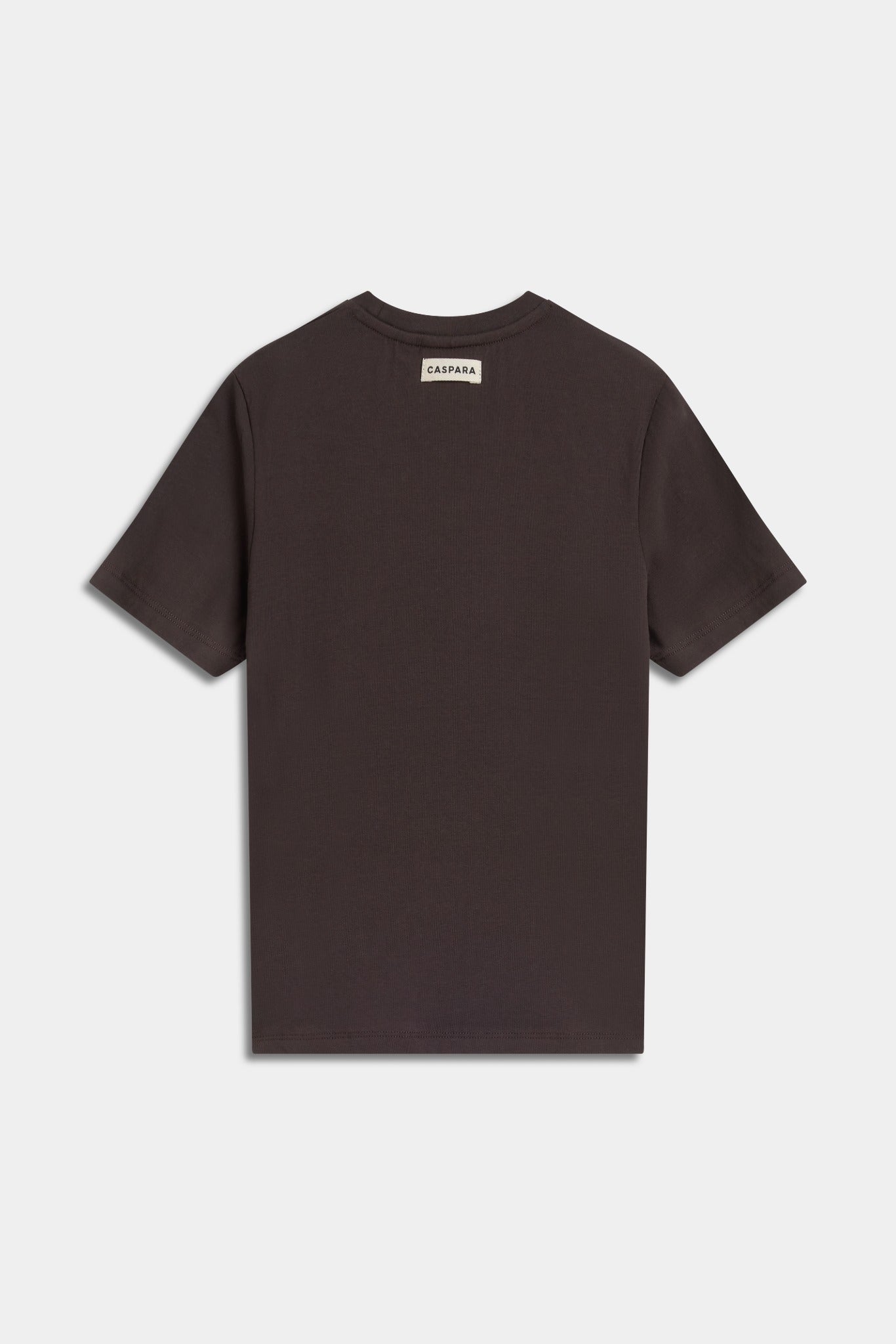 Back view of the espresso brown CASPARA baby tee with a small logo patch on the neckline.
