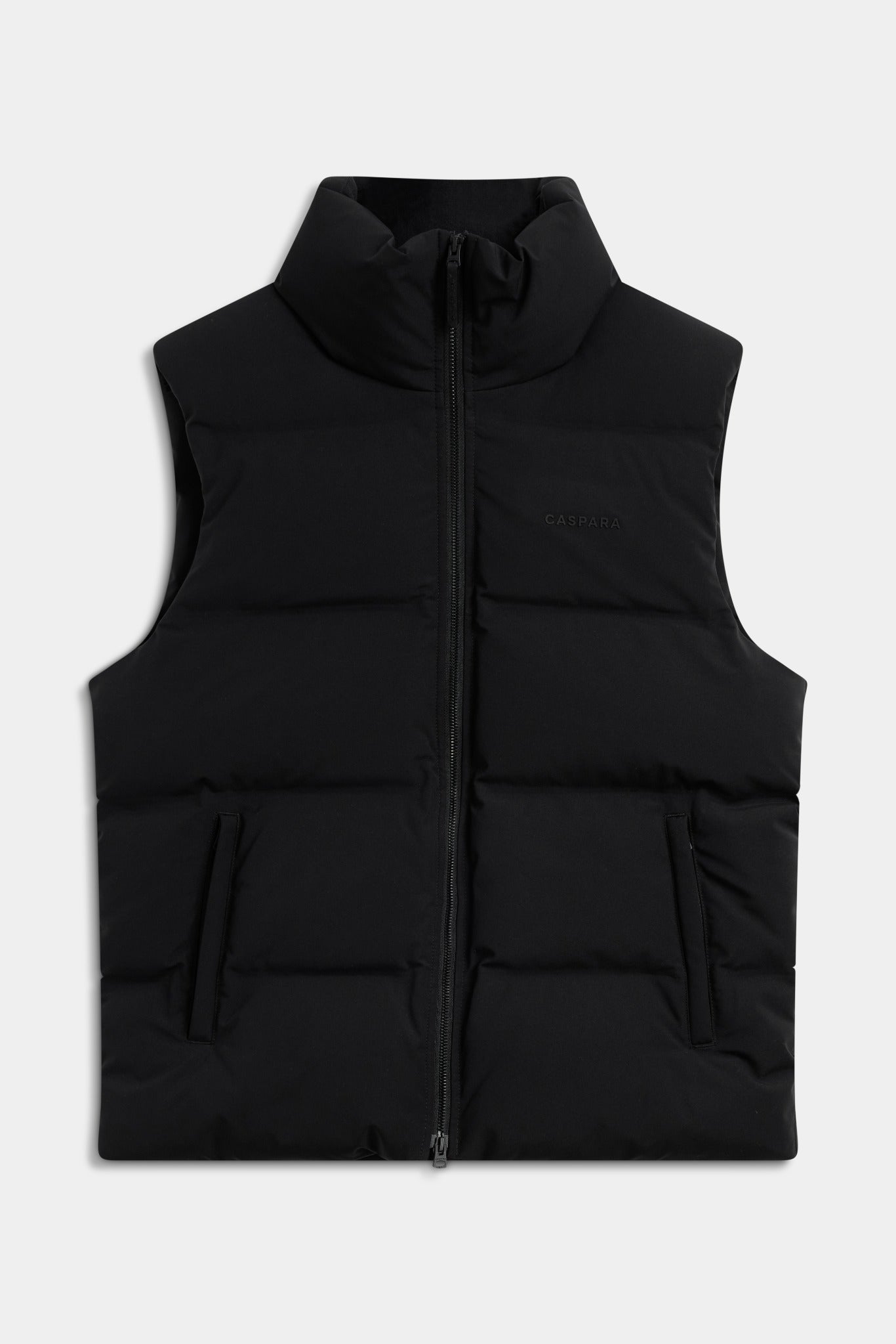 Black CASPARA Boreal puffer vest with a high collar and front zip against a light grey background.