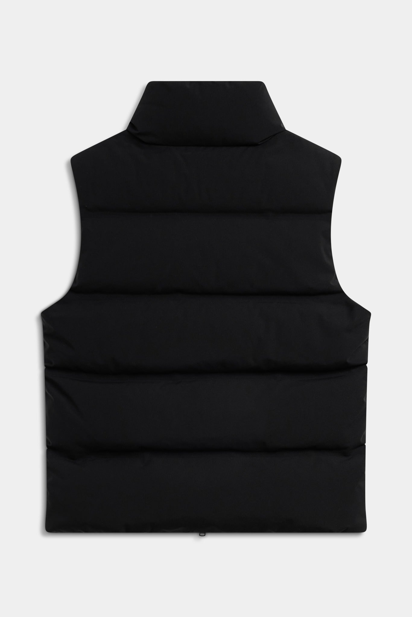Back view of the black CASPARA Boreal down puffer vest against a studio background.